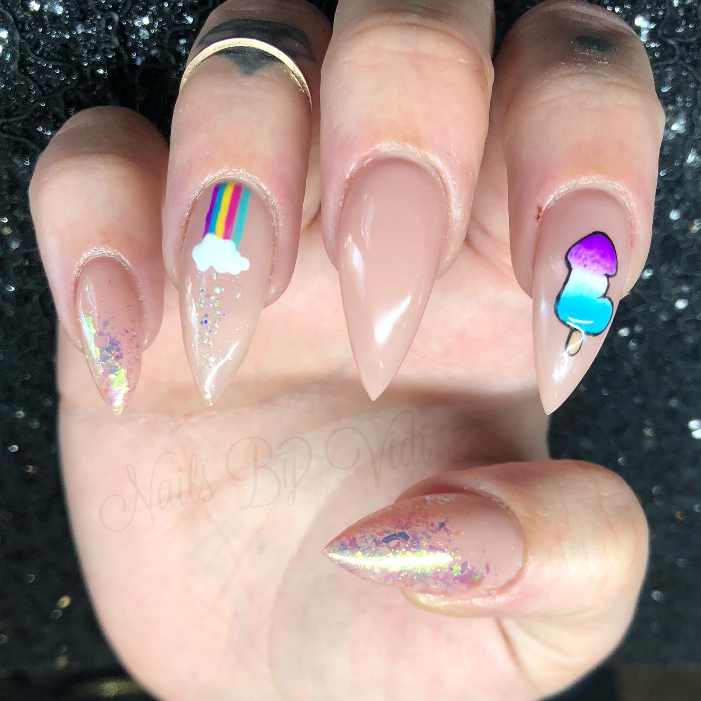 For the Pride month, we have a nice nail idea for you. On your nude base, some glitters look amazing with a rainbow and a penis ice cream.