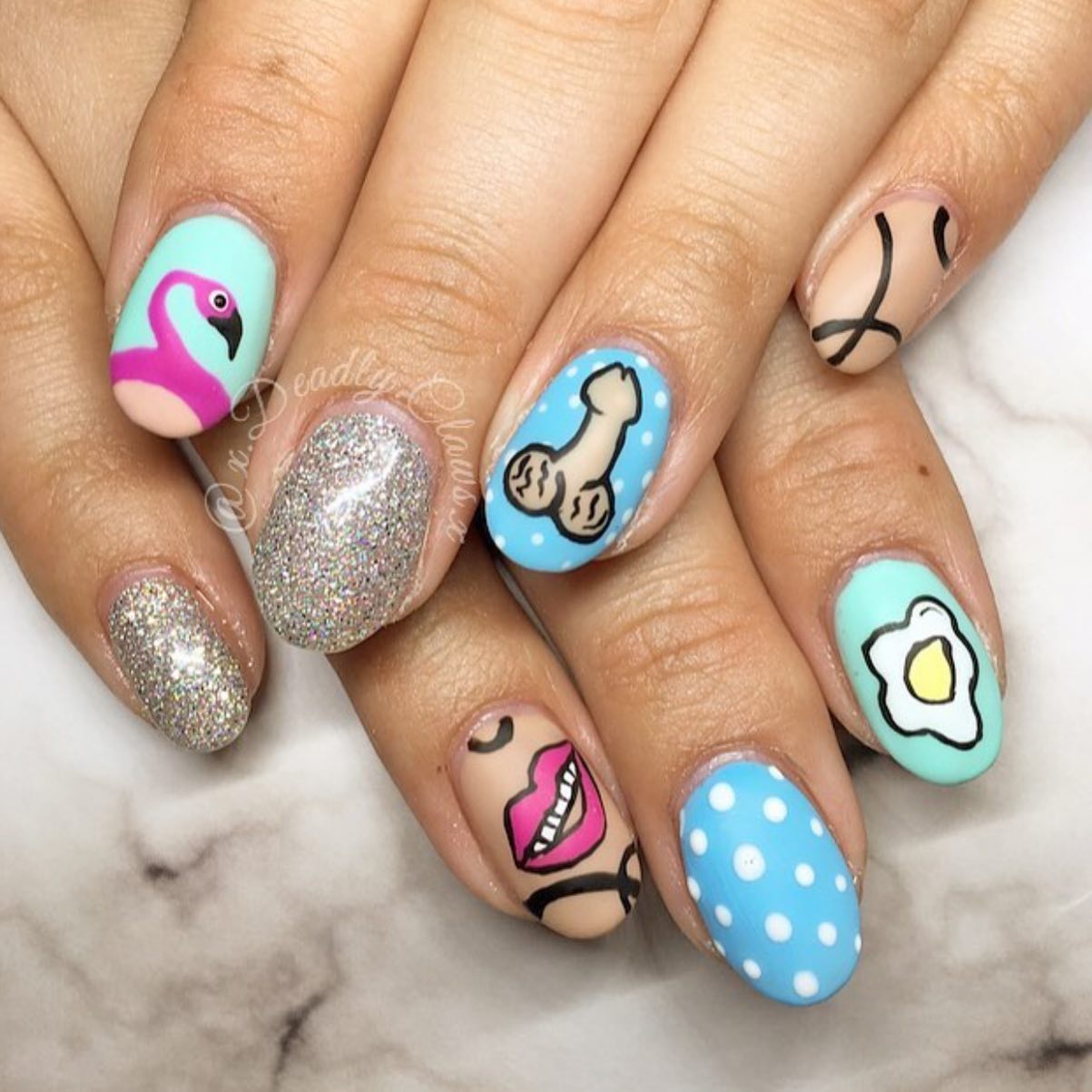 Flamingos and lips and penises, oh my god! Oh, and also an egg... This is for those who can go crazy with their nails.