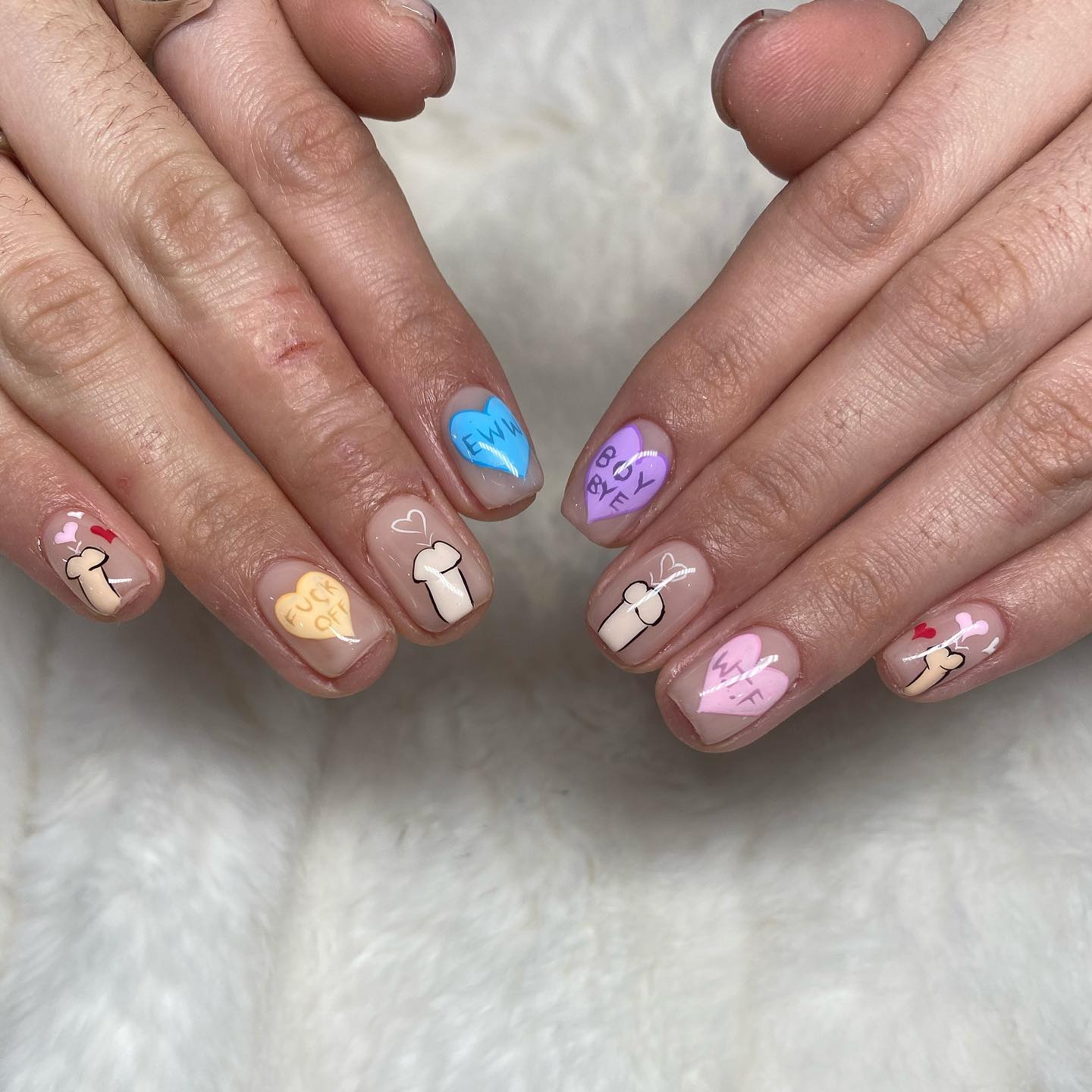 Your Valentine's Day will be full of joy with these nails. All you need is some colorful hearts that you can write something on and penises spouting hearts.