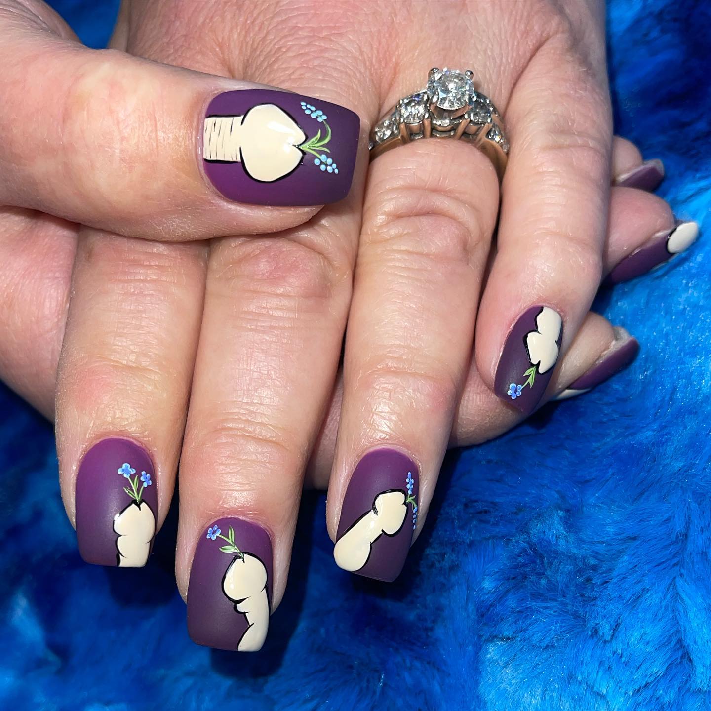 To make a penis nail art stand out, you need to use darker colors like this damson above. Plus, the penises spouting flowers are cute.