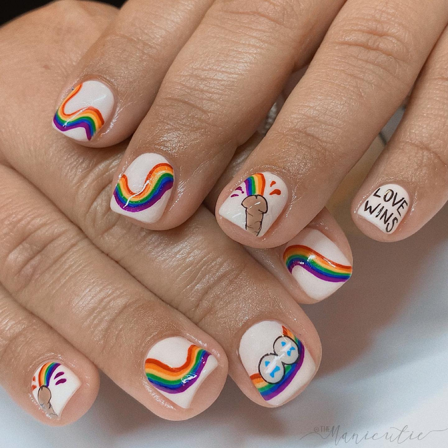 If you are looking for a nail art for the Pride, here is a perfect idea for you. Penises spouting a rainbow look cool.