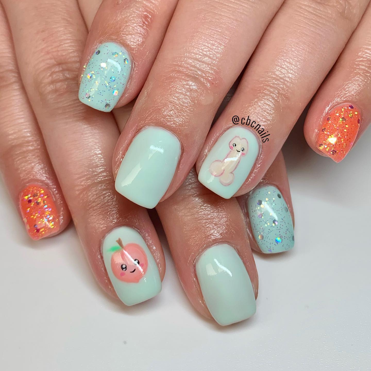 Baby blue and light orange nail polishes when combined with a peach and penis will take your nails to a new level!