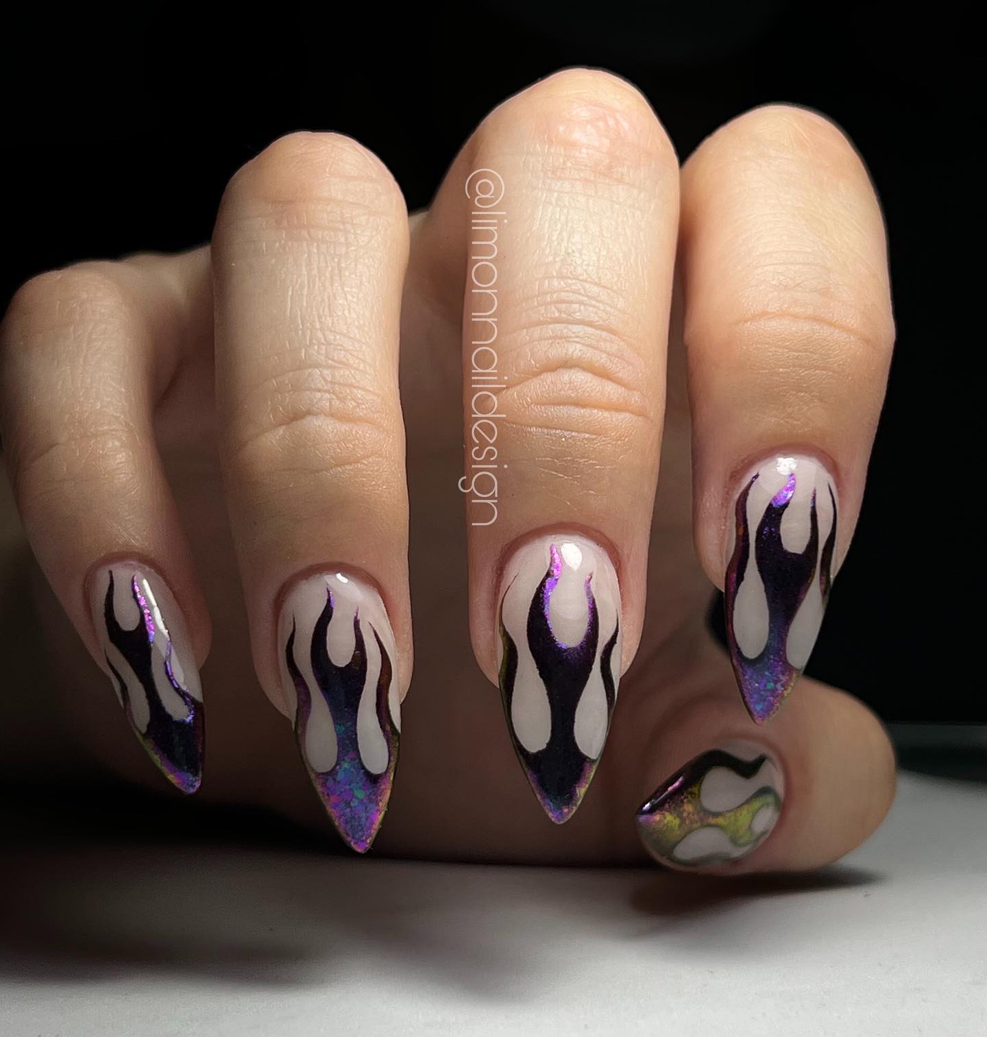 Flame nail designs are so popular these days and stiletto may be the best nail shape for this design. Also, the metallic nail polish looks amazing with these flames.