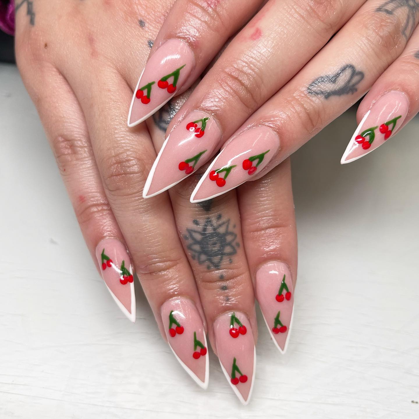Cherries have always been a perfect choice for nail arts. So, why not using them on your stiletto nails? Classic French tips are plus.
