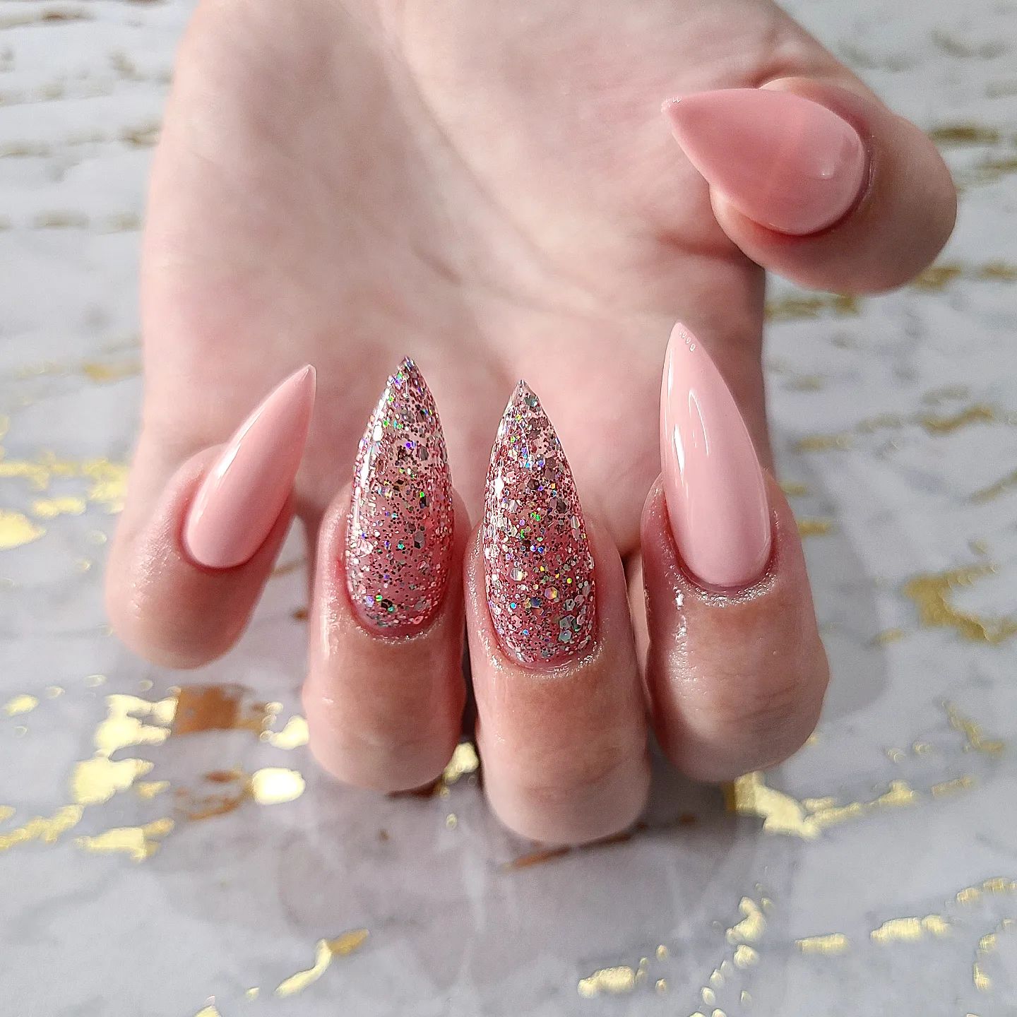 Nude nails are one of the classics but why don't you match this color with a stiletto mani? You can also add some glitters for your accent nails.