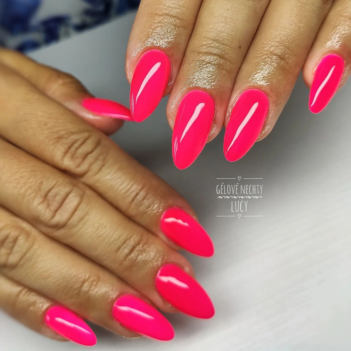Neon colors are the most favorite nail polishes in summer, aren't they? Your long almond nails will be amazing with neon pink color.