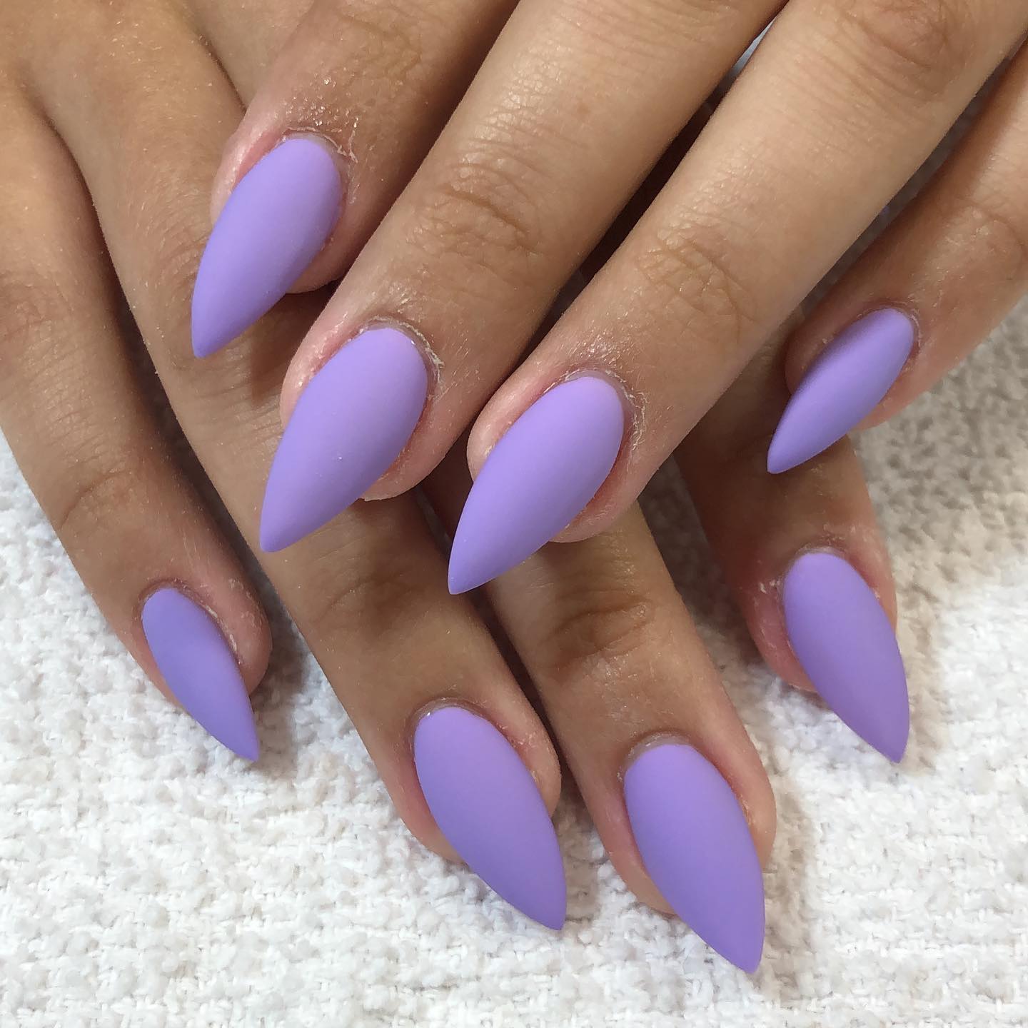 Matte nail polishes offer a bold and cool look for everyone. To make your matte look suitable for summer, lilac color is perfect.