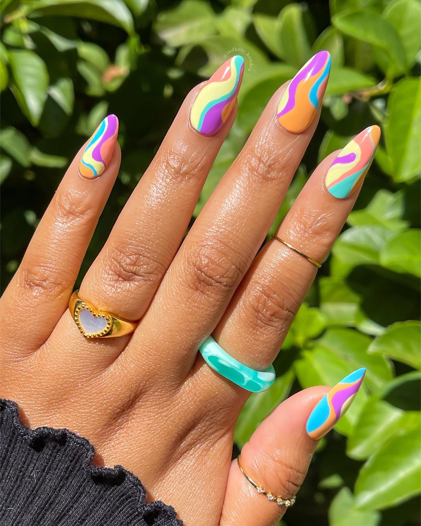 Can you see these amazing vibrant colors? For your summer nails, there is nothing better than having these giant swirls.