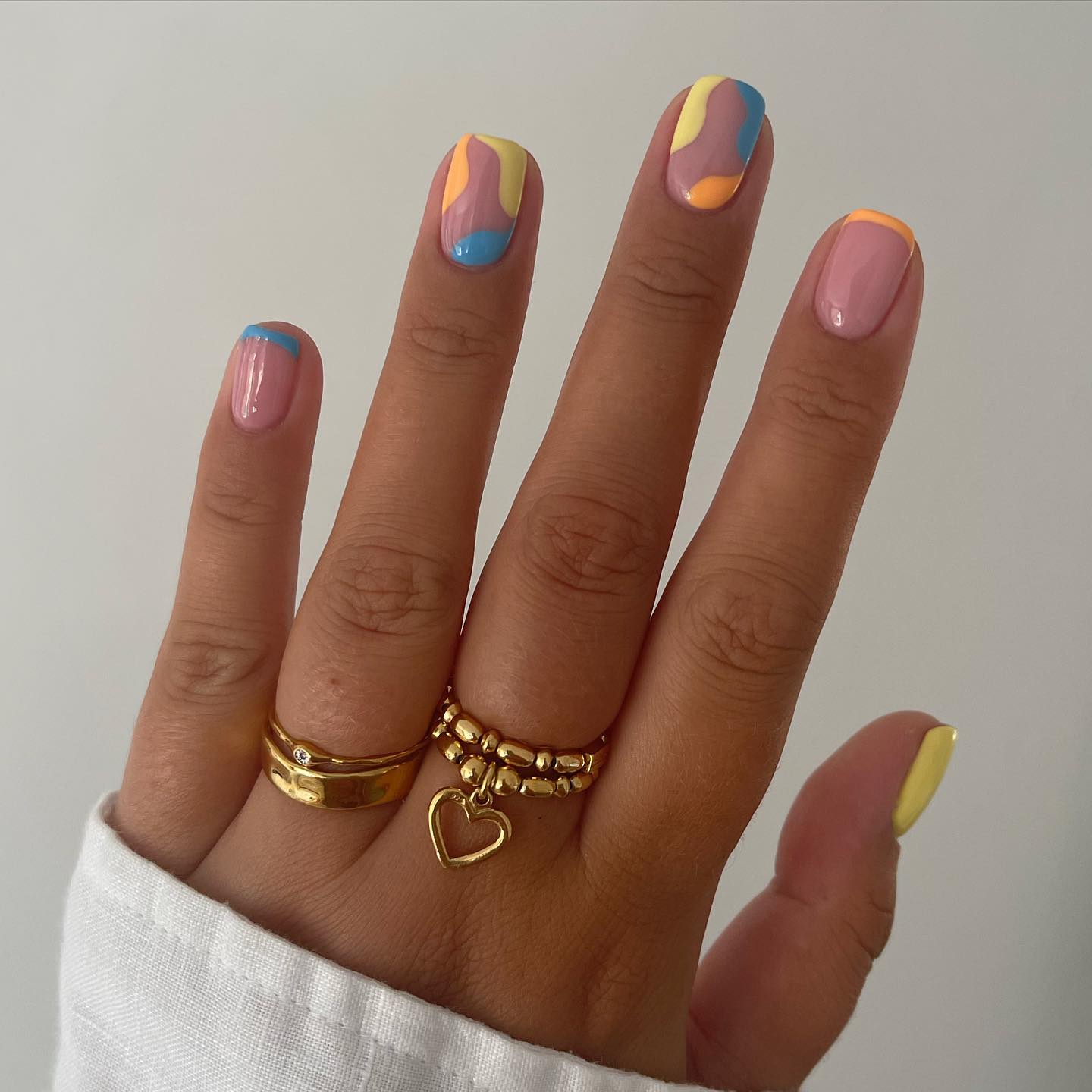 Pastel colors do not have to be something dark. Pastel yellow, orange and blue swirls are nice to give a shot.