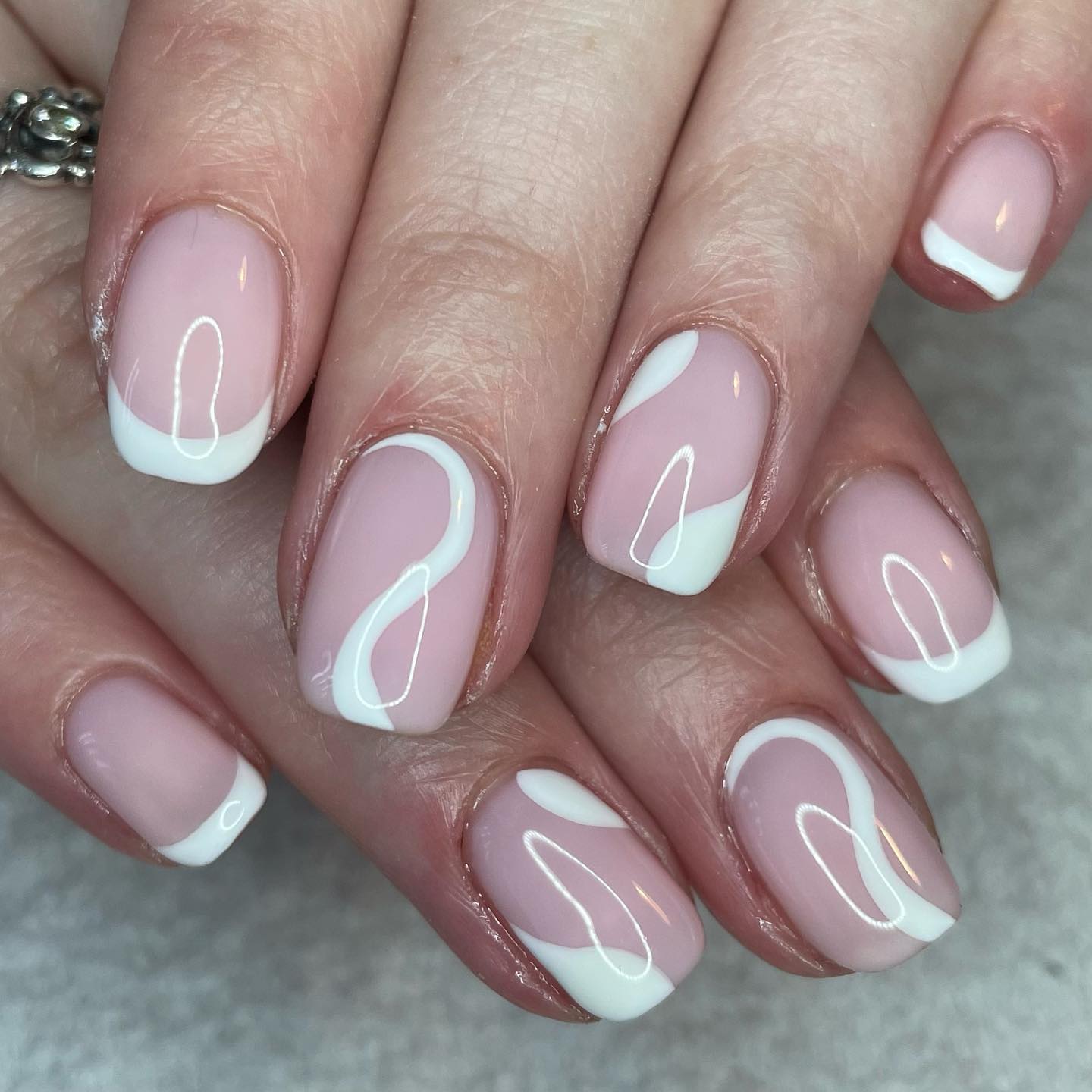 If you can't give up having a classic French mani, these swirls are for you. Big and thick swirls will go with your French mani.