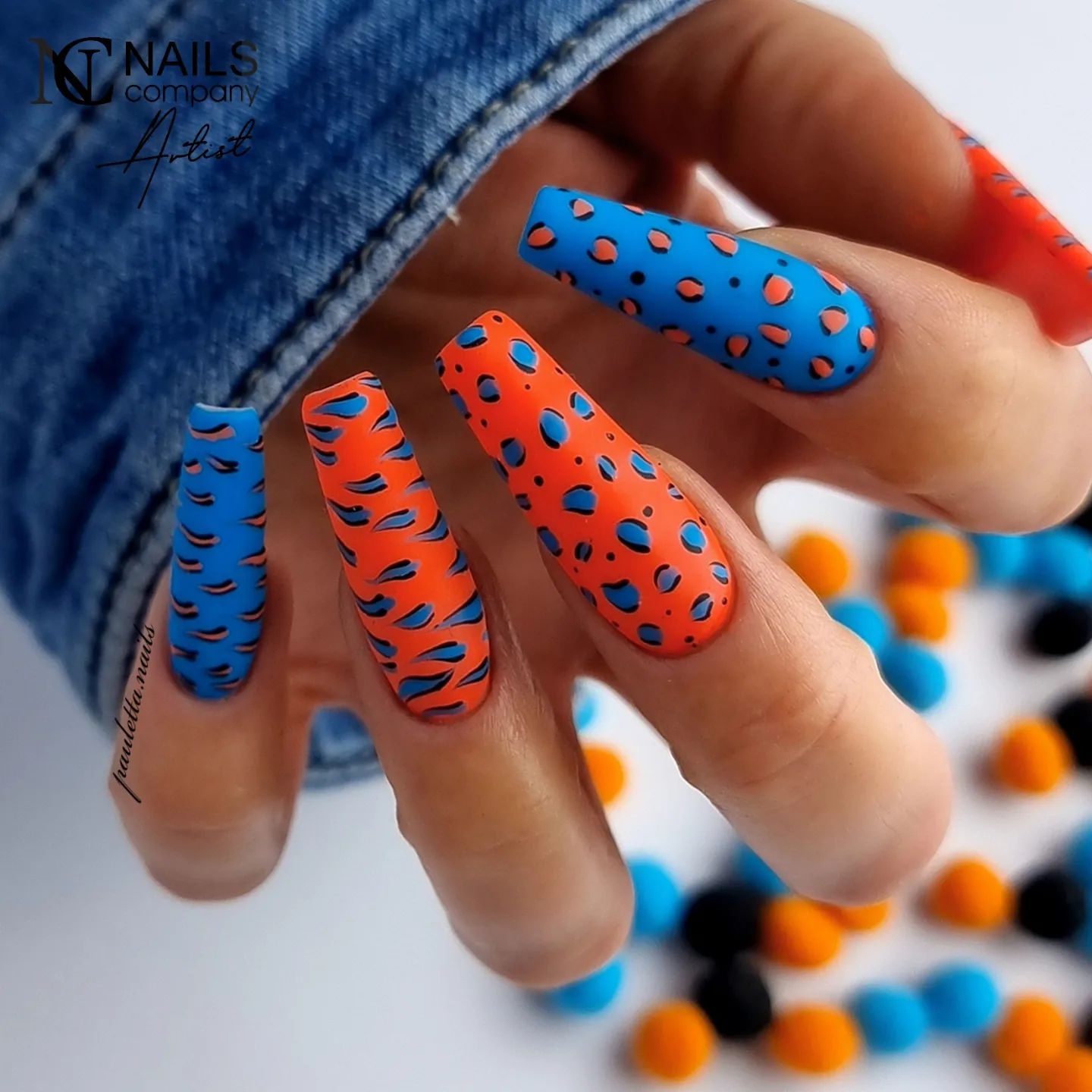To show your savage side to everyone, applying a panther nail art is a great idea. The combination of orange and dark blue will contribute a lot to your savage look.