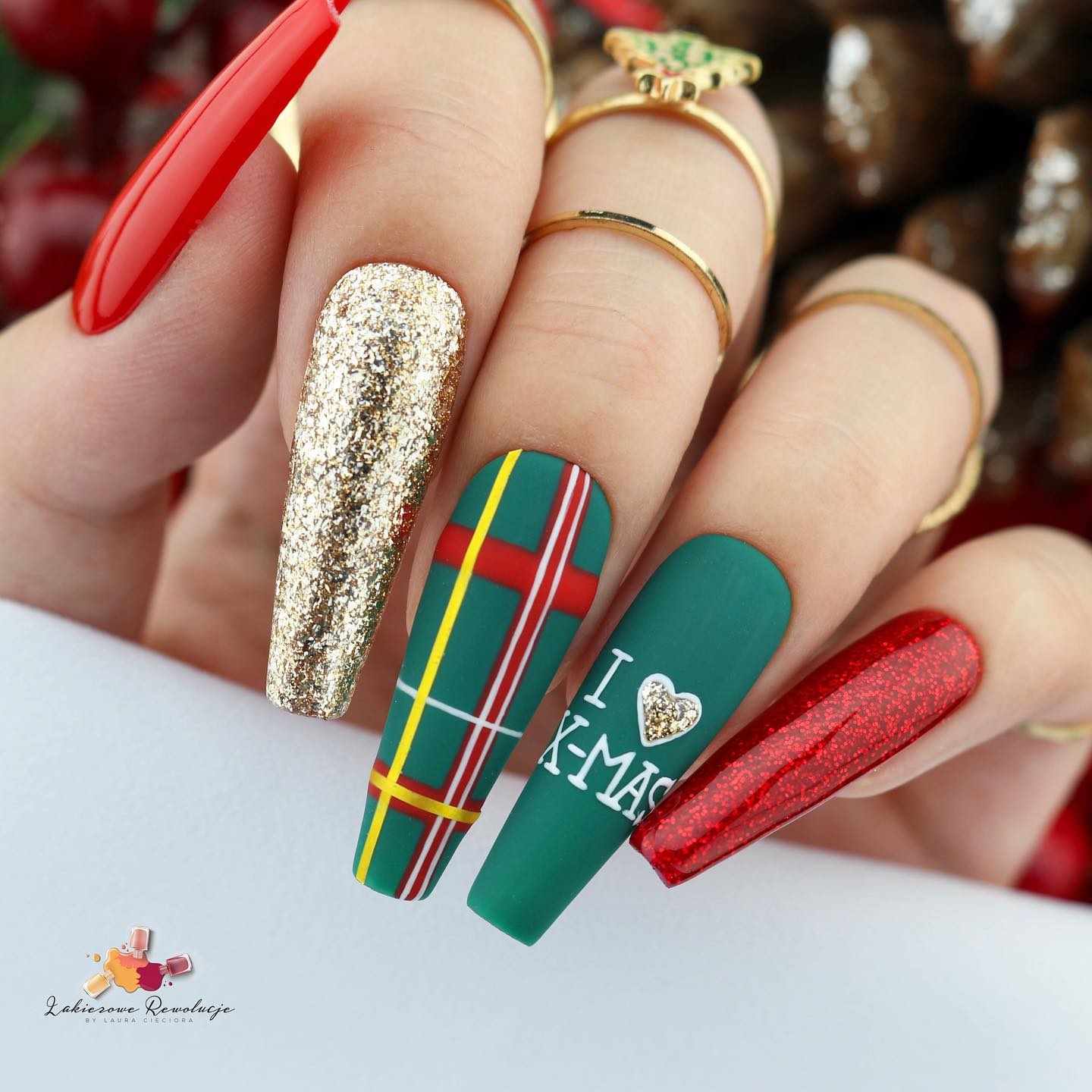 Christmas nails are a great way to get into the Christmas spirit. They're festive, they're sparkly, and they make you feel like the holidays are here!  Matte dark green and glittered red and golden nail polishes will help you get into that spirit.