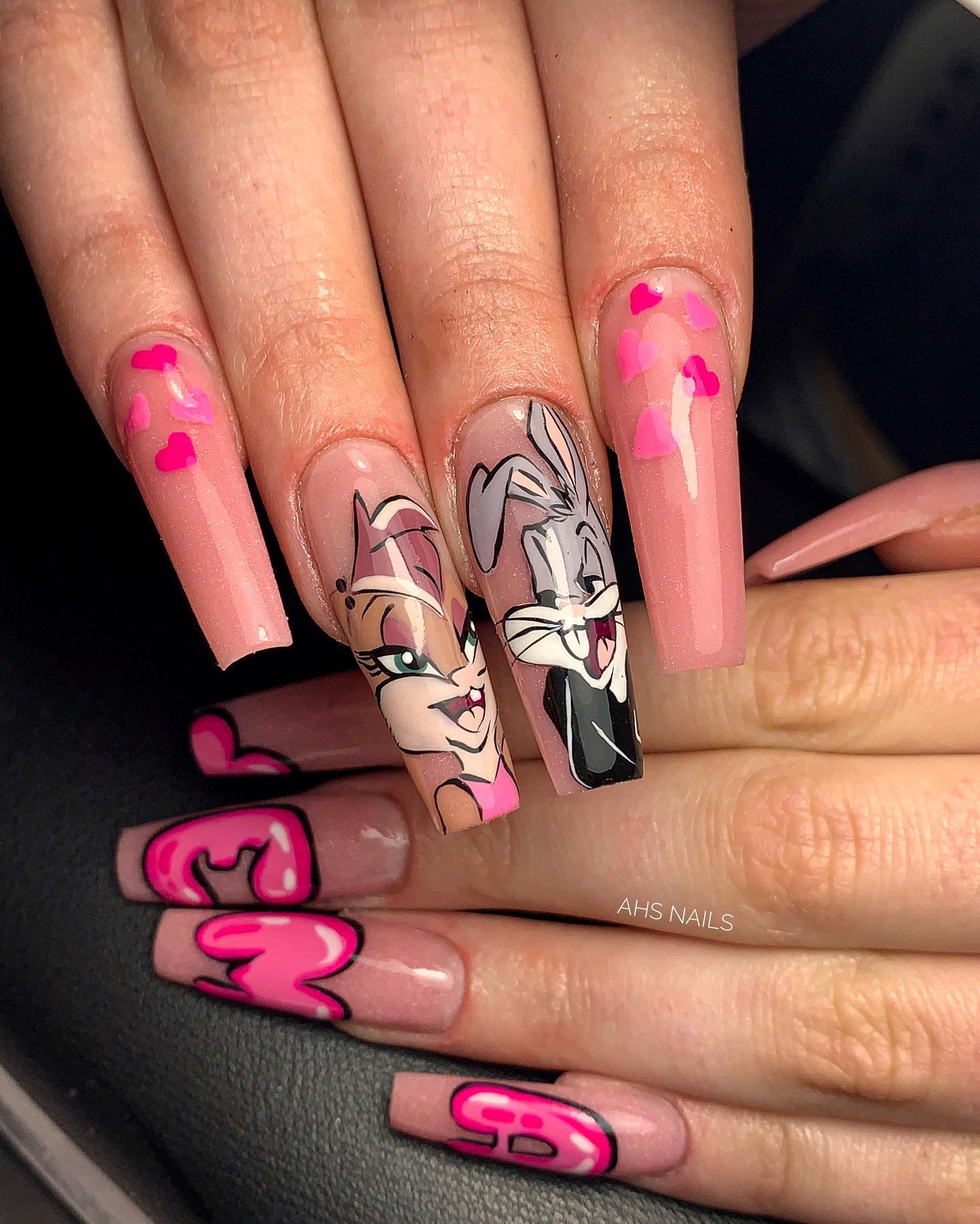 Bugs Bunny nails are a great way to express your love for the Looney Tunes character and add a little fun to your look. Pink color and hearts make this nail design so cute.