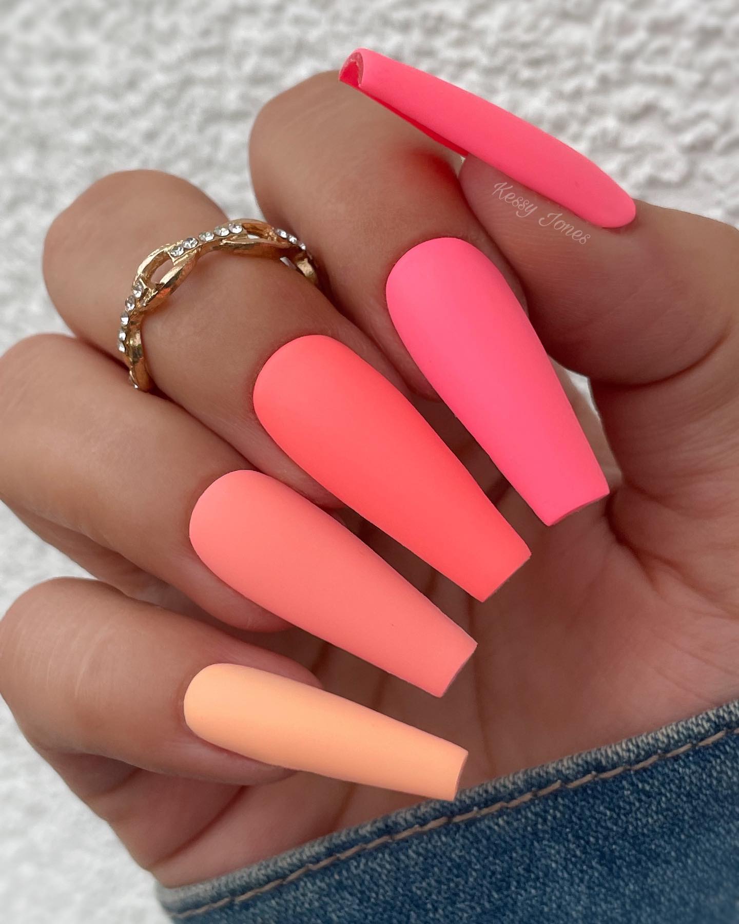 Matte nails are always gorgeous! They are so chic, and they last longer than regular nail polish. By using vibrant colors like the one above, you can stand out easily. A color palette which starts from neon pink and goes on with lighter shades of pink and orange is all you need to shine.