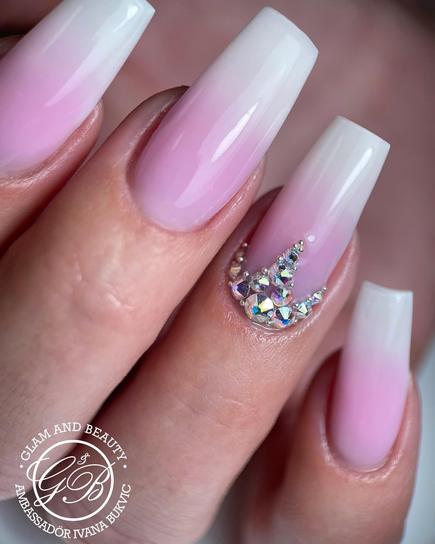 Ballerina nails are a good fit for ombre nail art! To look chic and stylish, keep your nails simple white tip with a pink base. If you think this is so basic, add some gemstones to your accent nail to shine.