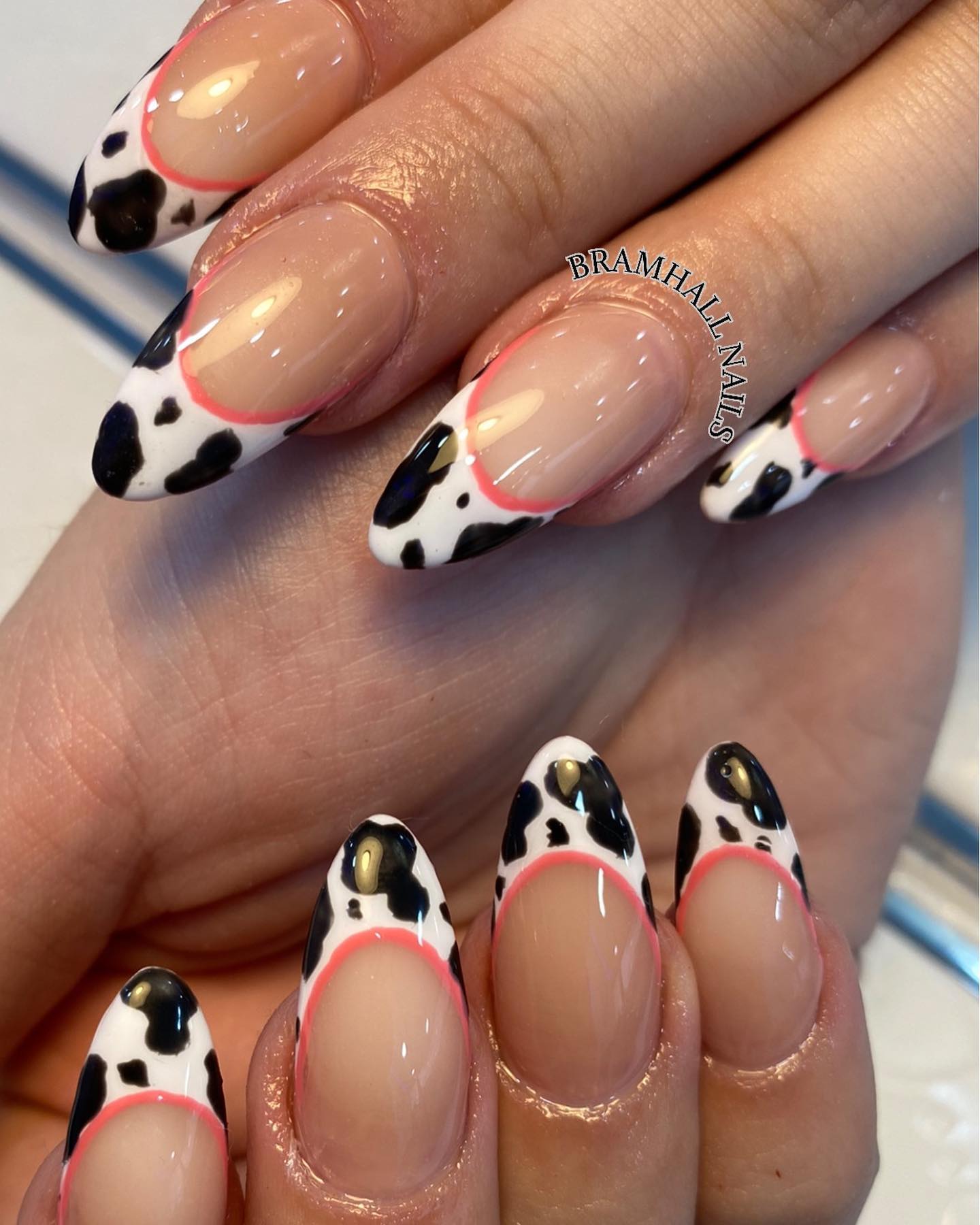 Using cow print nail art on your tips is a great way to add some fun to your look, but still keep it classy. Between the nude nail polish and cow print tips, a reddish color is used to take this mani to a whole different level because it looks amazing!
