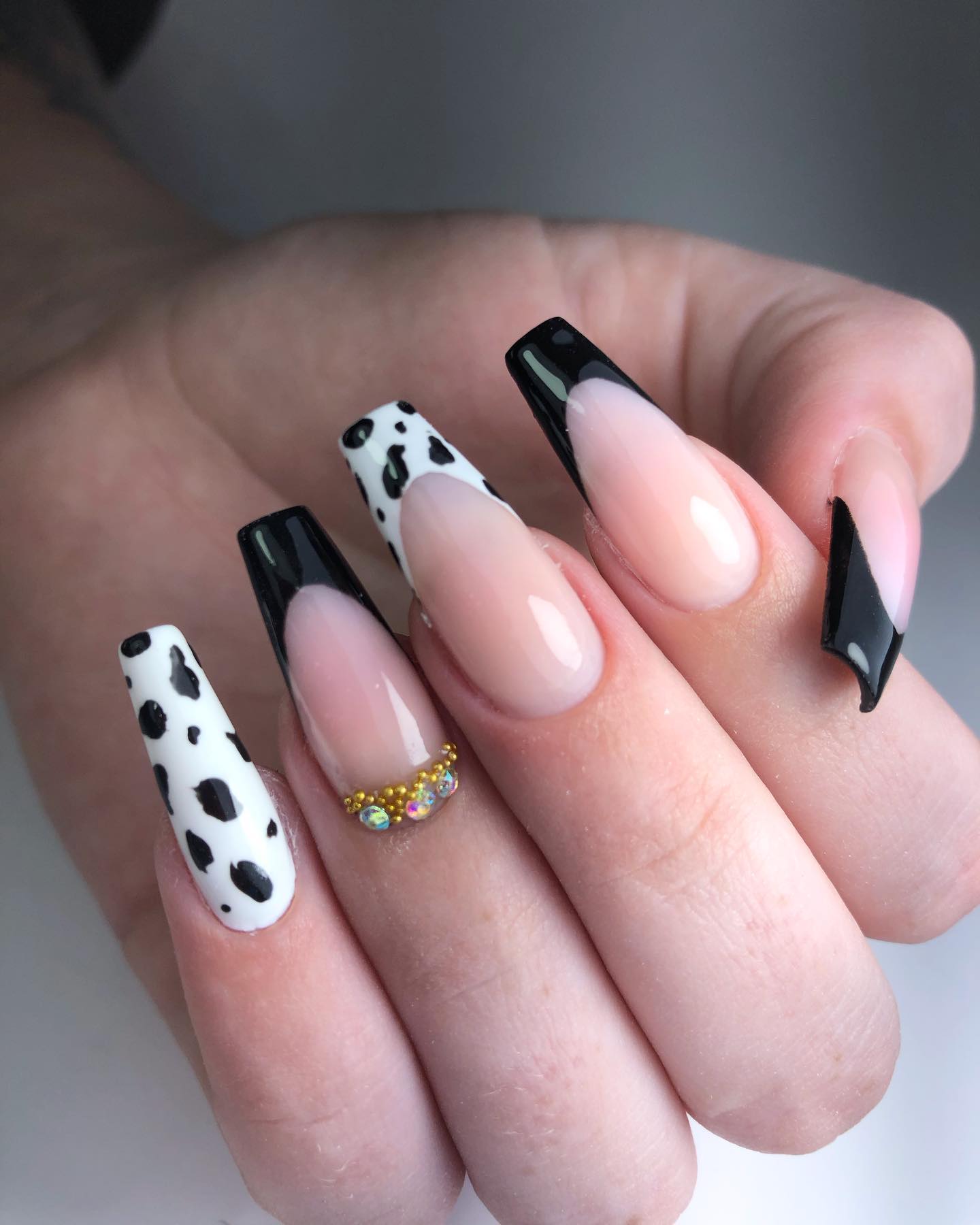Here is an another cow print French mani idea but in this one, it is used as an accent nail. Black is such an elegant color that it turns everything into an art piece, so let's combine these two!