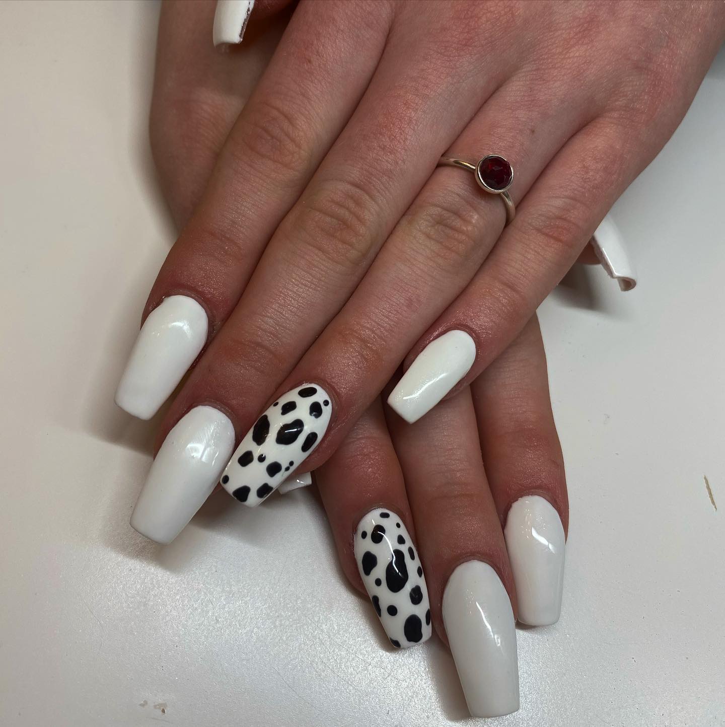 Covering all of your nails with cow prints may not be your thing, so here is a great idea to use a cow print nail art for just one nail. Plus, white is a clean and simple color, but it can also look elegant and sophisticated, depending on how you style it.