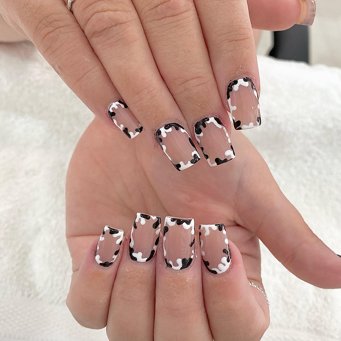 Cow print framed nails are the best! It is so unique and interesting, and the final look is incredible. The contrast between white and black is what makes these nails amazing. Plus, the frames give it a really interesting effect.