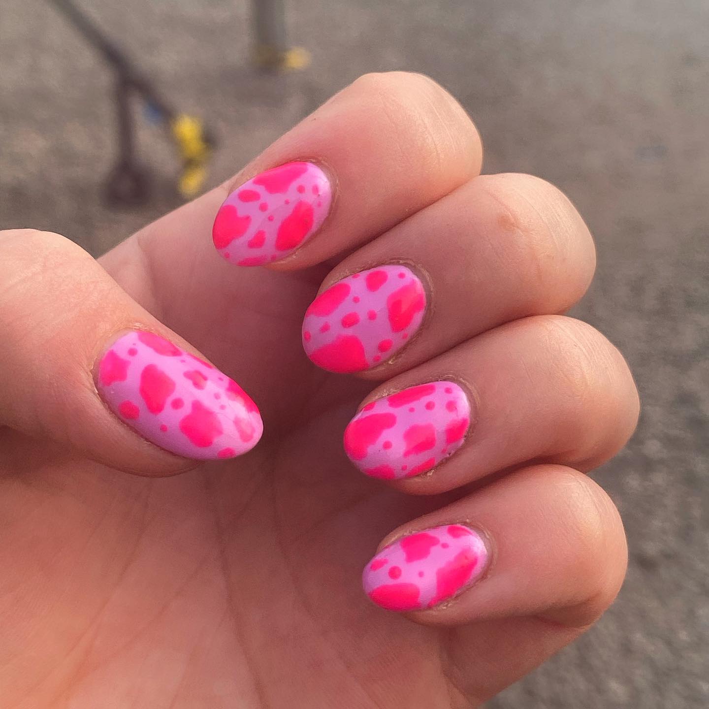 Who doesn't like pink nails? They're just so... feminine! When you look down at your hands and see that little pop of color, you will feel great. In addition to this beauty, you can apply neon pink cow print nail art to look greater.