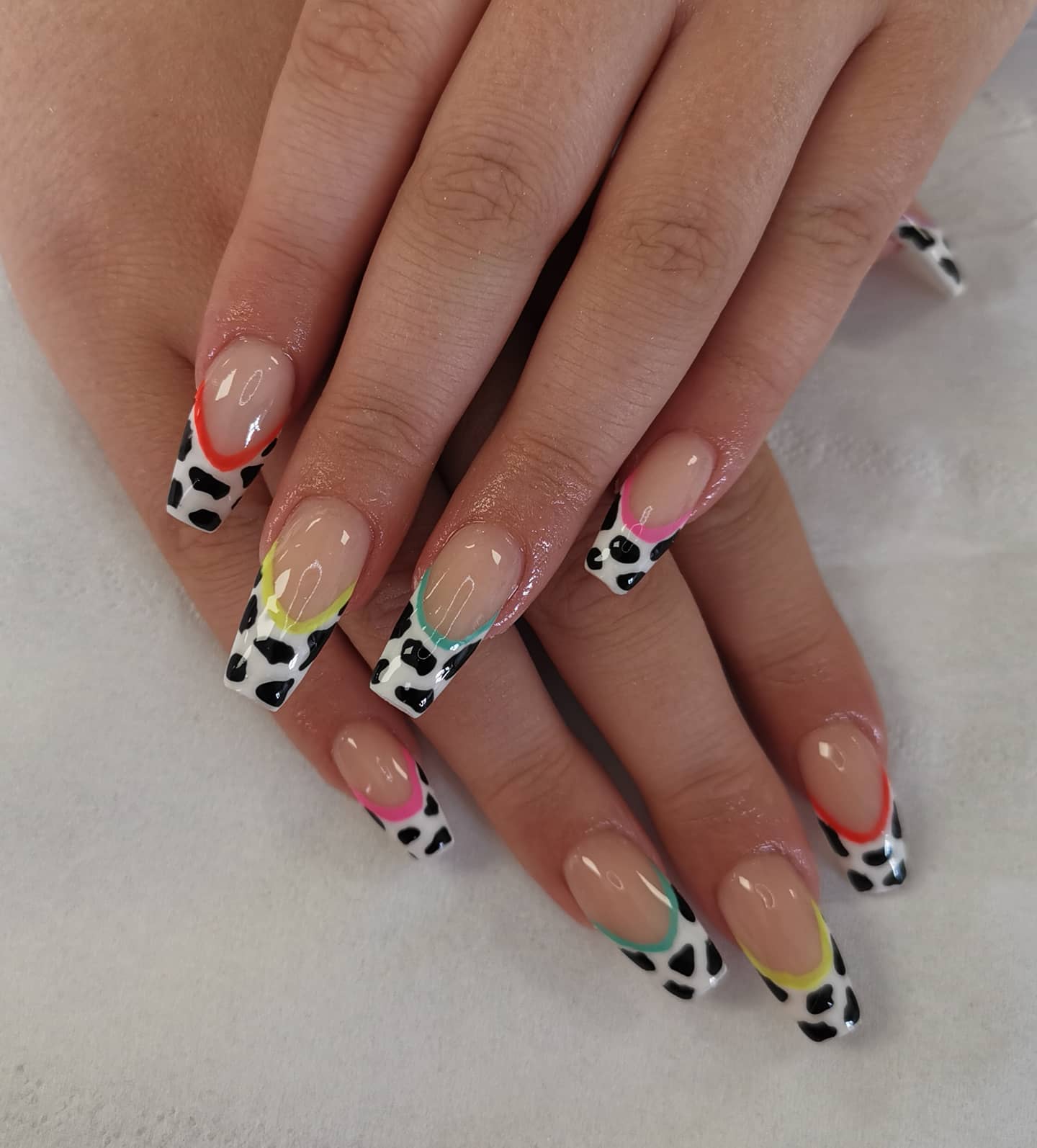 It's great to see how one simple nail can be turned into something so elegant. French tips are always important when it comes to nail art, so let's make a combo. Plus, colorful lines for each nail look amazing, too.