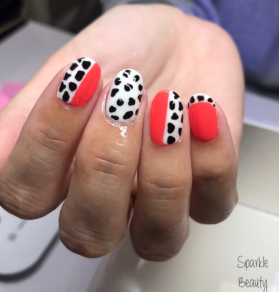 Who can say no to red? It is the color of passion, love and beauty. To make red nail polish more fun, let's add cow prints. The cow print is fun, and the red is bold. What a great combination!
