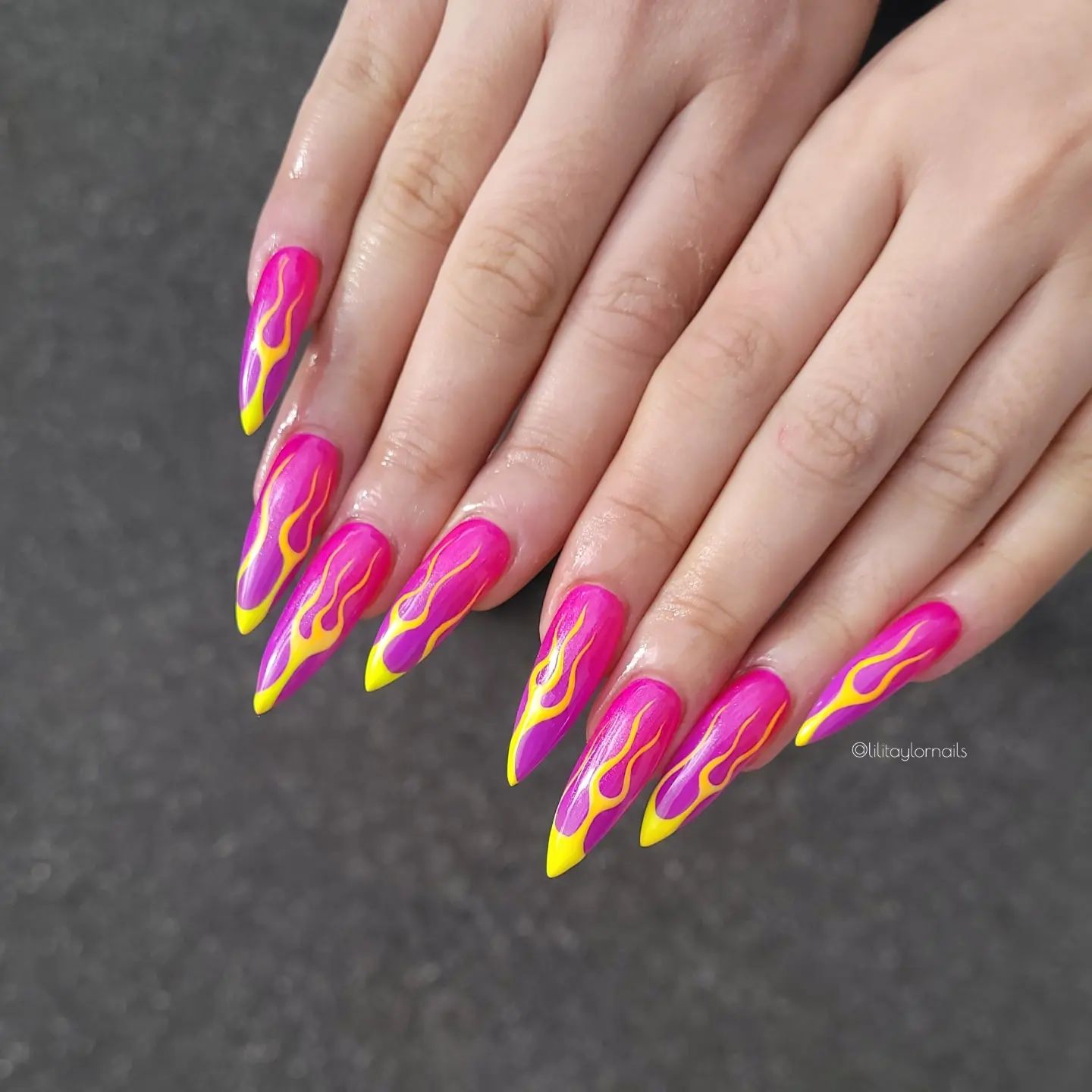 If you are looking for a flair to your outfit, go should go for these pinky flame nails. The pink nail polish gets darker to the tips and this looks quite amazing. Plus, yellow flames add these nails a greater look.