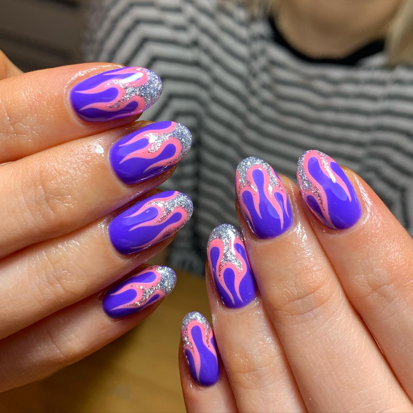 There is no need to have long nails to have a flame nail art. Your almond nails will shine with silver glittered and pink flames. Go and get it girl.