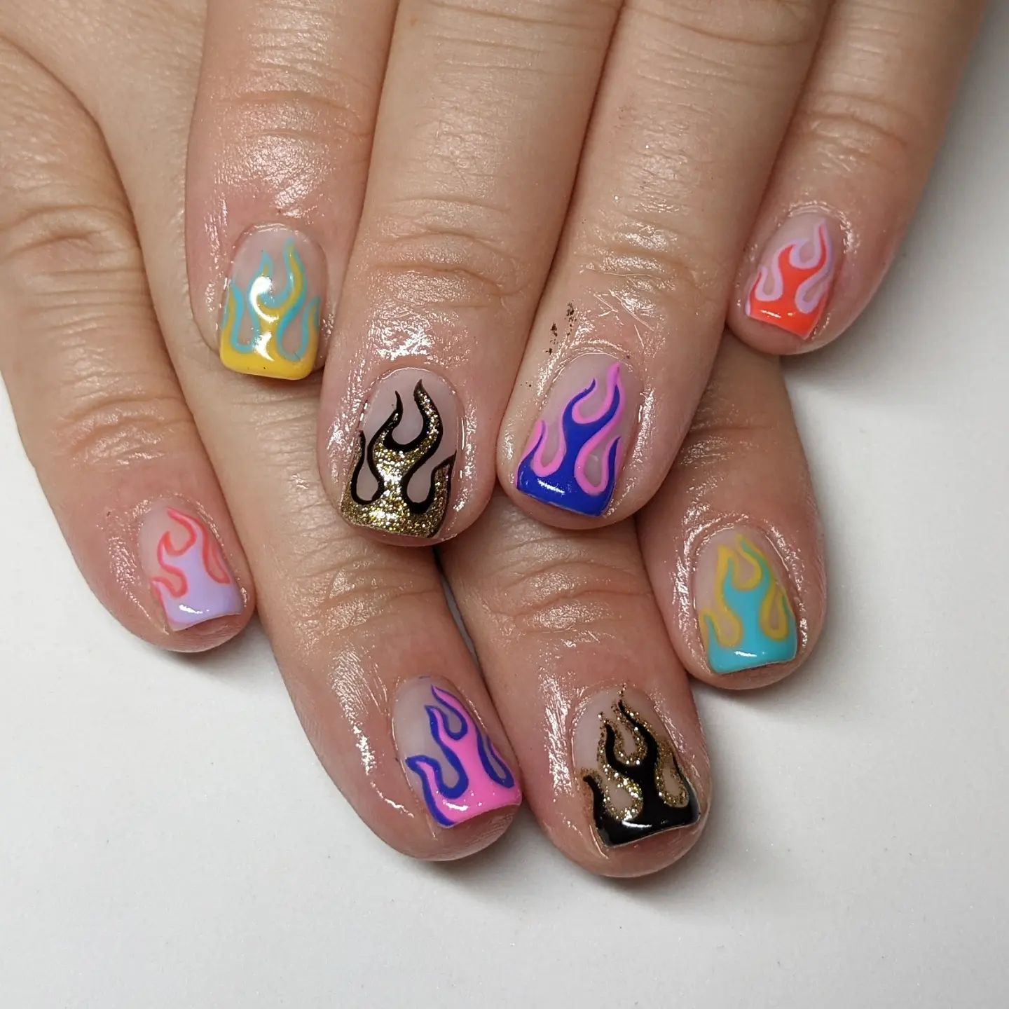  It is hard to choose which color to apply for your flame nails, so why don't you combine different colors together in one nail design? Adding different colored edges will make your flames stand out more.