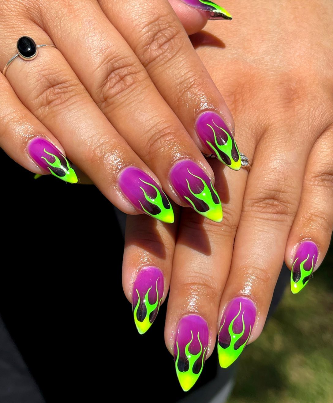 Ombre nails have always been a favorite manicure for many years and this time purple color gets darker to the tips above and it looks quite fabulous. To make it better, neon green flames should definitely be used. Go flame girl!