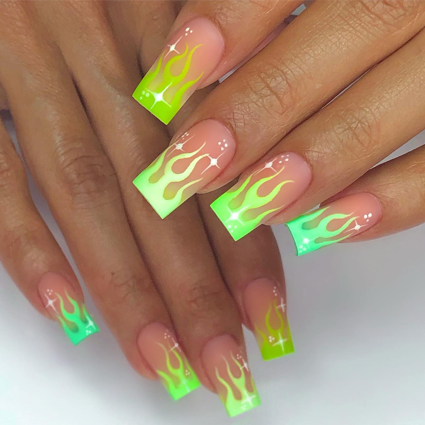 Neon heat waves are all you need to get the feeling of perfection. For each nail, different shade of neon green is applied. With their vivid and bright colors, these flames will make you rock.