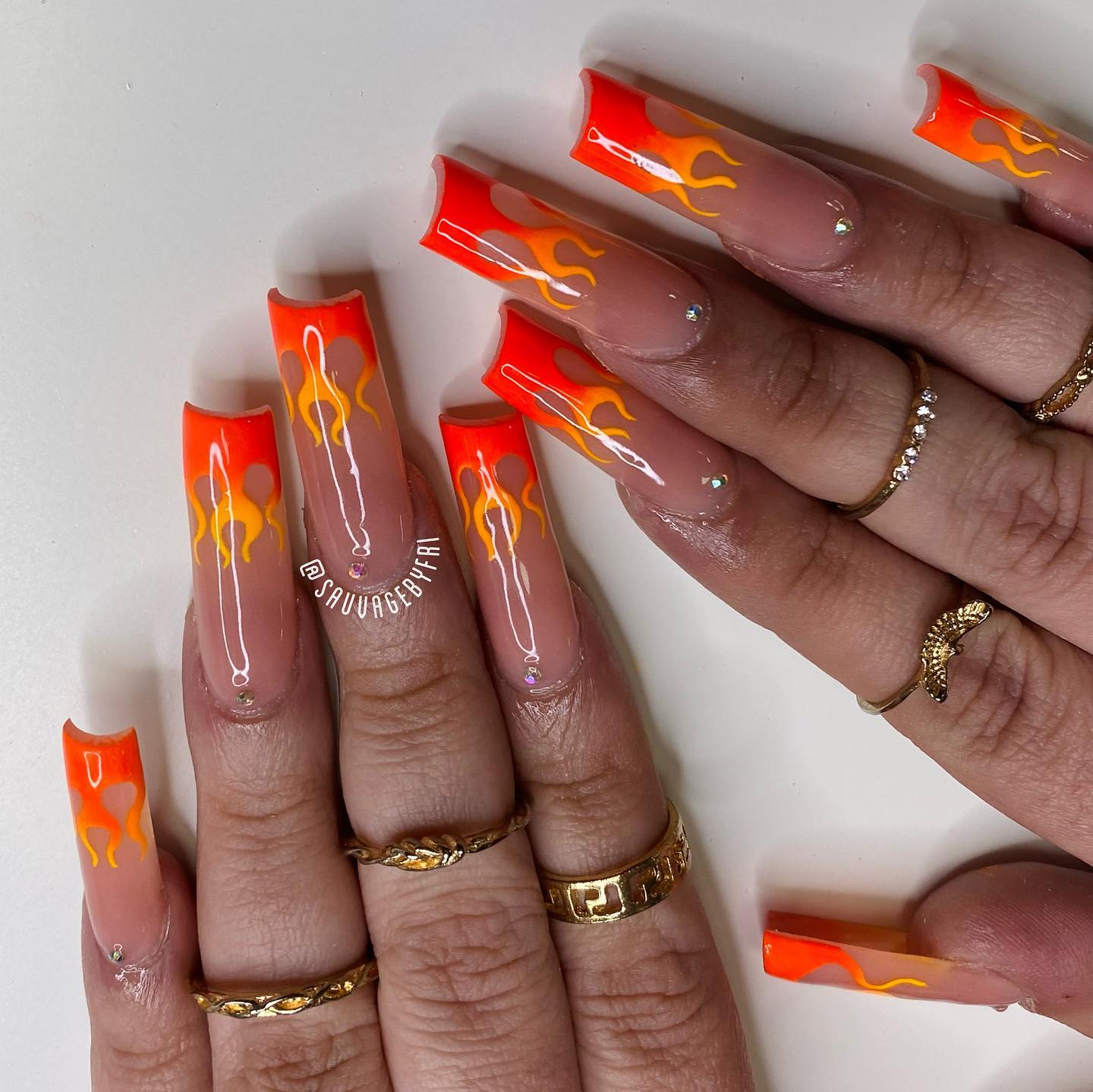 In most fires, orange and red colours are the common ones. So, they are highly preffered in flame nails, too. Why don't you have these on your nails to show everyone that you are a flame girl with your long acrylic nails?