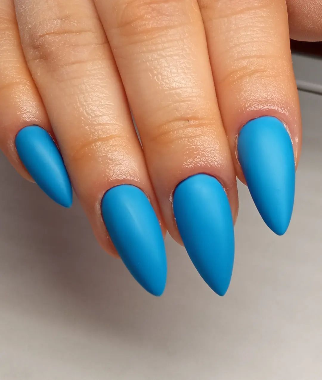 Feel the freedom with blue nails. The nails above are long and they are painted in such a great blue shade. It is also a good idea to decorate it with silver or gold gems or glitters.