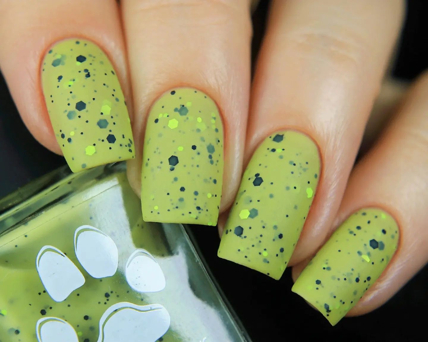 Green is the color of nature and it is a very soothing one. Let's get a light shade of it with the matte nail polish. To have fun with your green matte nails, all you need to do is to add some dark green glitters.