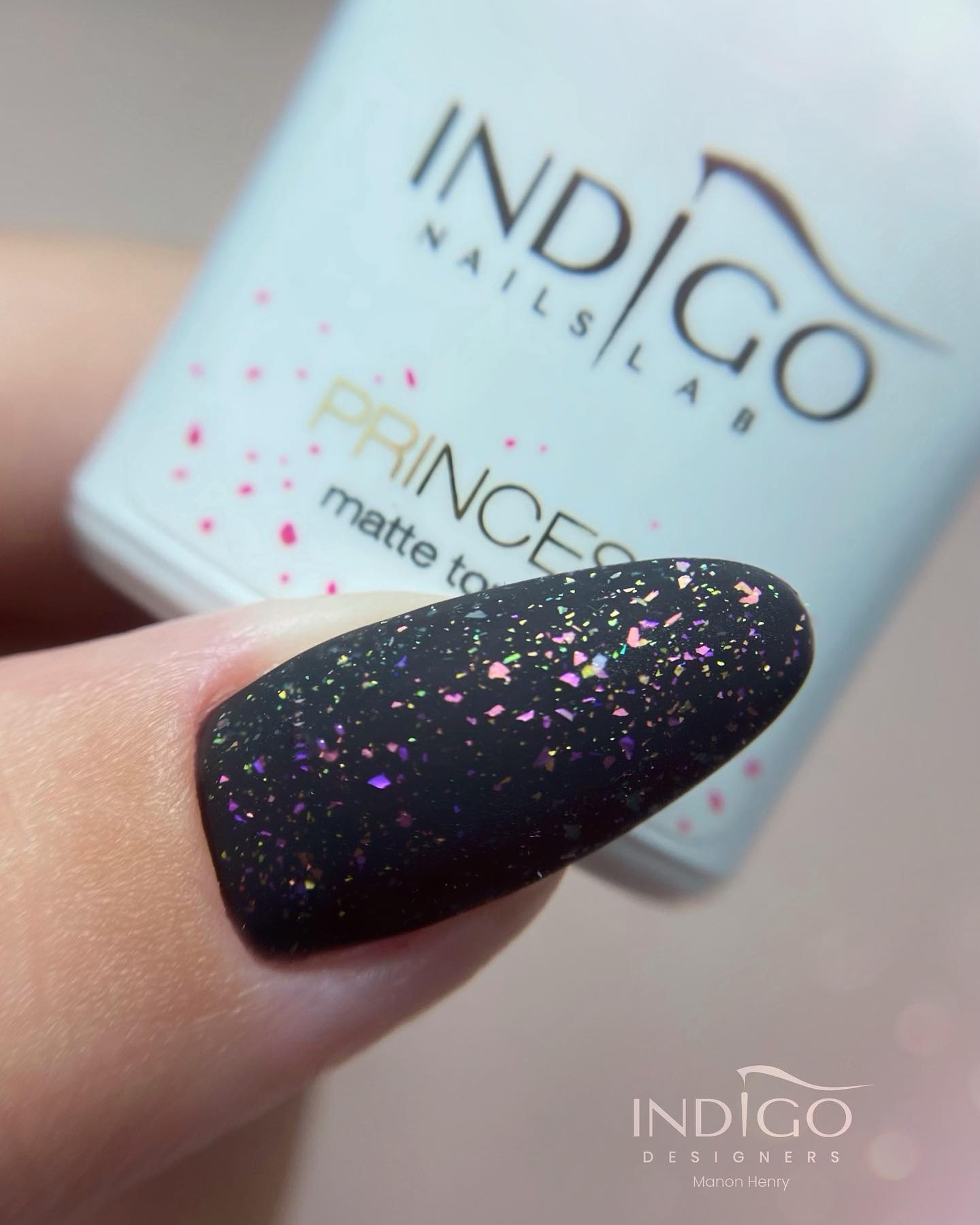 Long almond nails are always a favorite but you can add an extra beauty with a black matte nail polish. Plus, some colorful glitter details can help you achieve a fabulous look.
