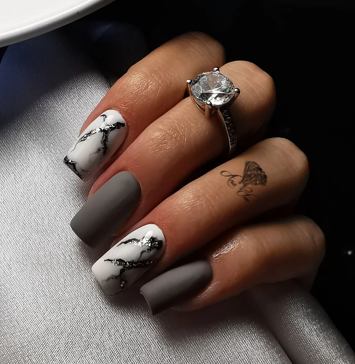 If you are a modest and sophisticated person, grey nail color is definitely for you! Dark matte grey nails will help you shine with your square mani. For accent nails, marble nail art which continues to grow in popularity is a great choice to combine.