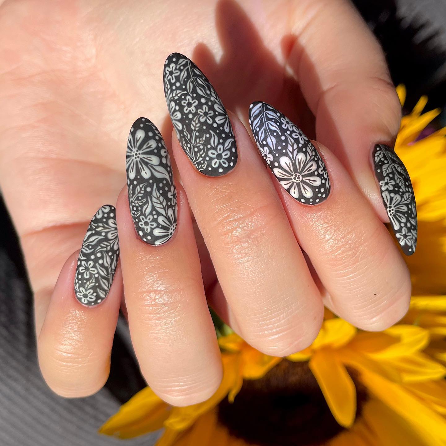 The matte black is a great color choice as it is so versatile. It works with a lot of different outfits and looks great on any skin tone. To make it greater, white flower nail art can be used to offer a very pretty touch. The combination of these two is a perfect combo.