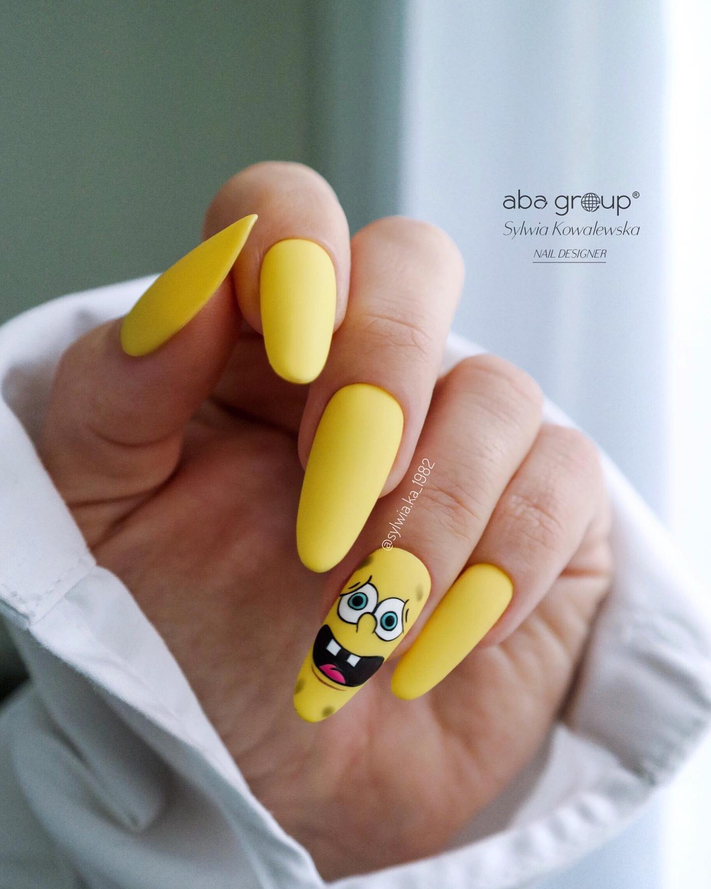 If you want to have fun with your nails, try out the sponge bob nail art with matte yellow nail polish. The best part about this particular design is that it looks great on both short and long nails.