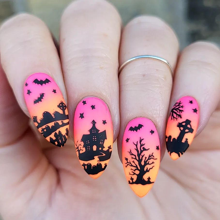 Here is an amazing Halloween nail inspiration for you. Pink and orange ombre nails are taken to a different level with black drawings of bats, graveyards and ghosts. Looking cute and scary at the same time is quite easy with this design.