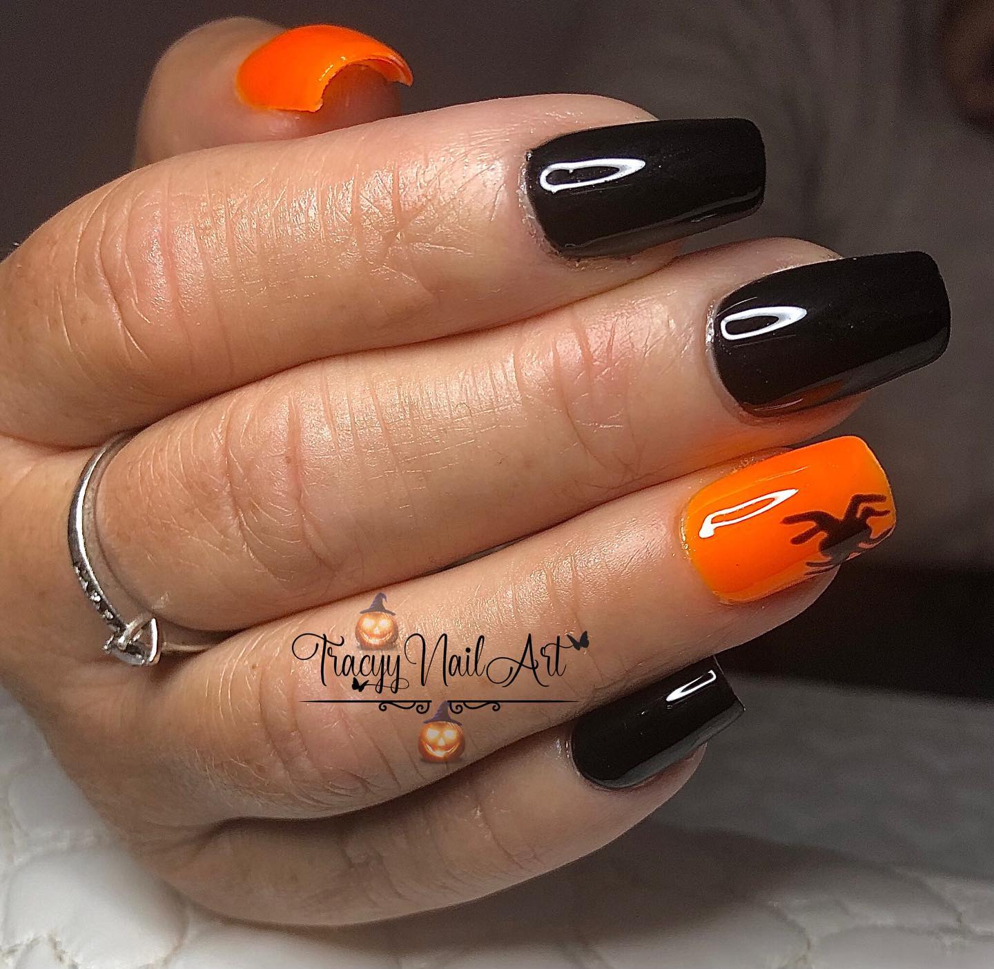 Here is a great Halloween inspired nails to adore! Applying neon orange nail polish for your accent nails and drawing a small spider near the tips are a great way to show off your style!