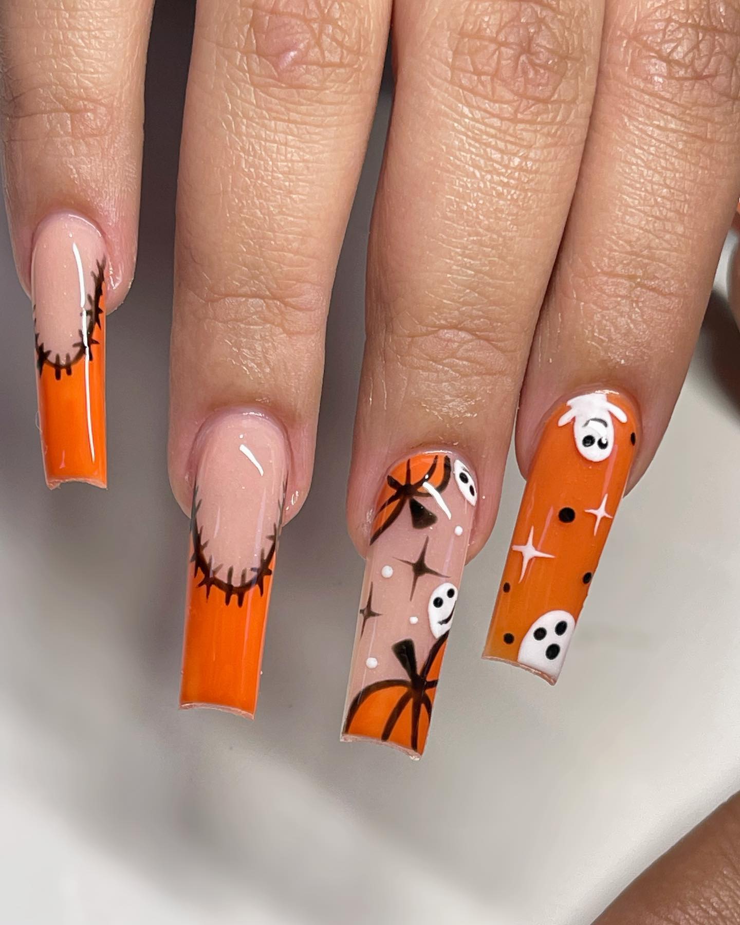 Gel nails are great since they are super durable and they look so chic but why not making them more fabulous with orange nail polish? Plus, ghosts, pumpkins barbed wires will make you look like a Halloween queen.
