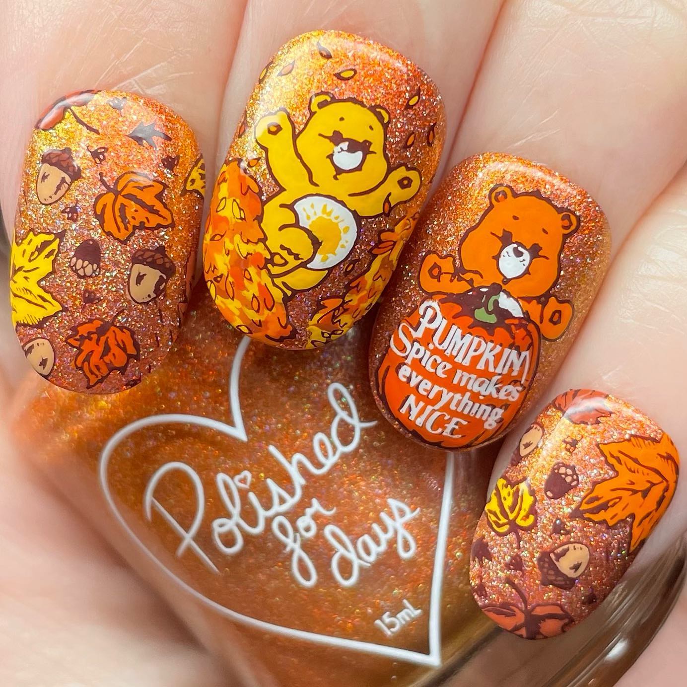 Are you a fan of teddy bears? Then, let's give the nail design above a shot. These cute teddy bears will make you smile and feel the autumn vibes with falling leaves. In addition, dark orange glitters are a great choice to have fun with your nails.