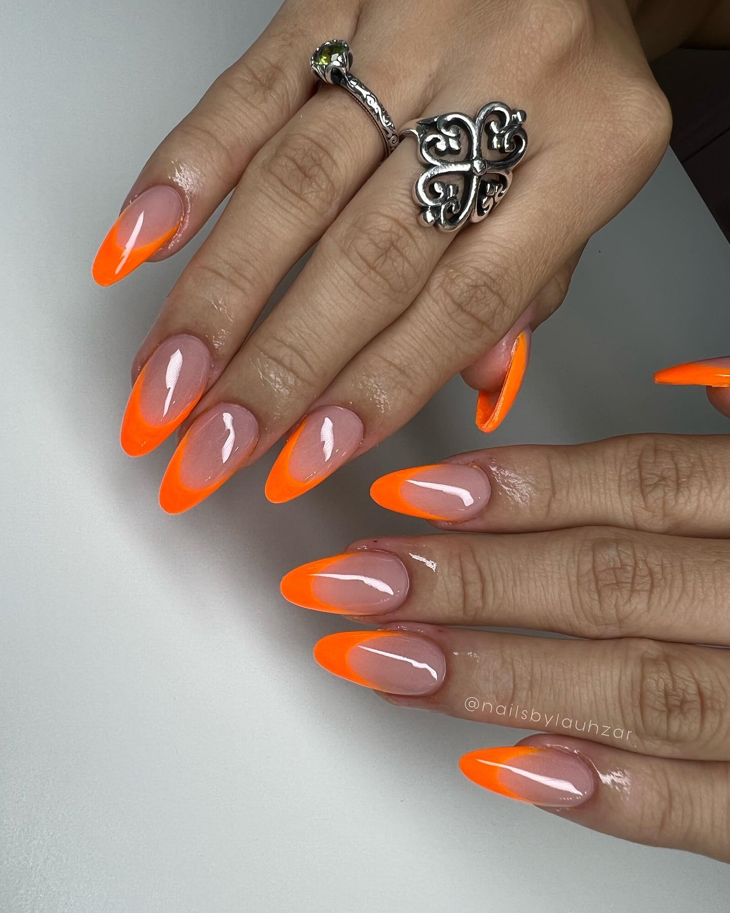 Here is the bomb. Neon orange French tips are an amazing way to express yourself! They're so vibrant and fun, and they look so good on everyone. It's great how bright the color is and it's such a unique shade that you can't find anywhere else!