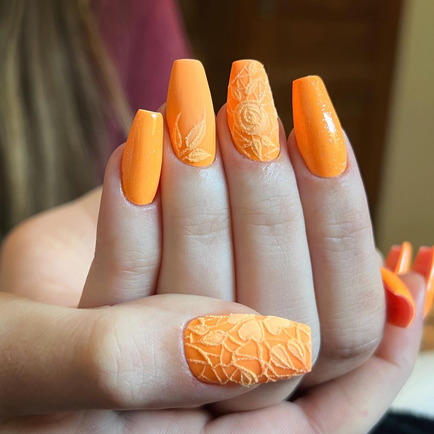 Lace nail art is not something new but there are a few women who still go on applying them. If you like it, you should make a combo with lace and orange color. This floral lace work is ready to give you some authentic vibes!