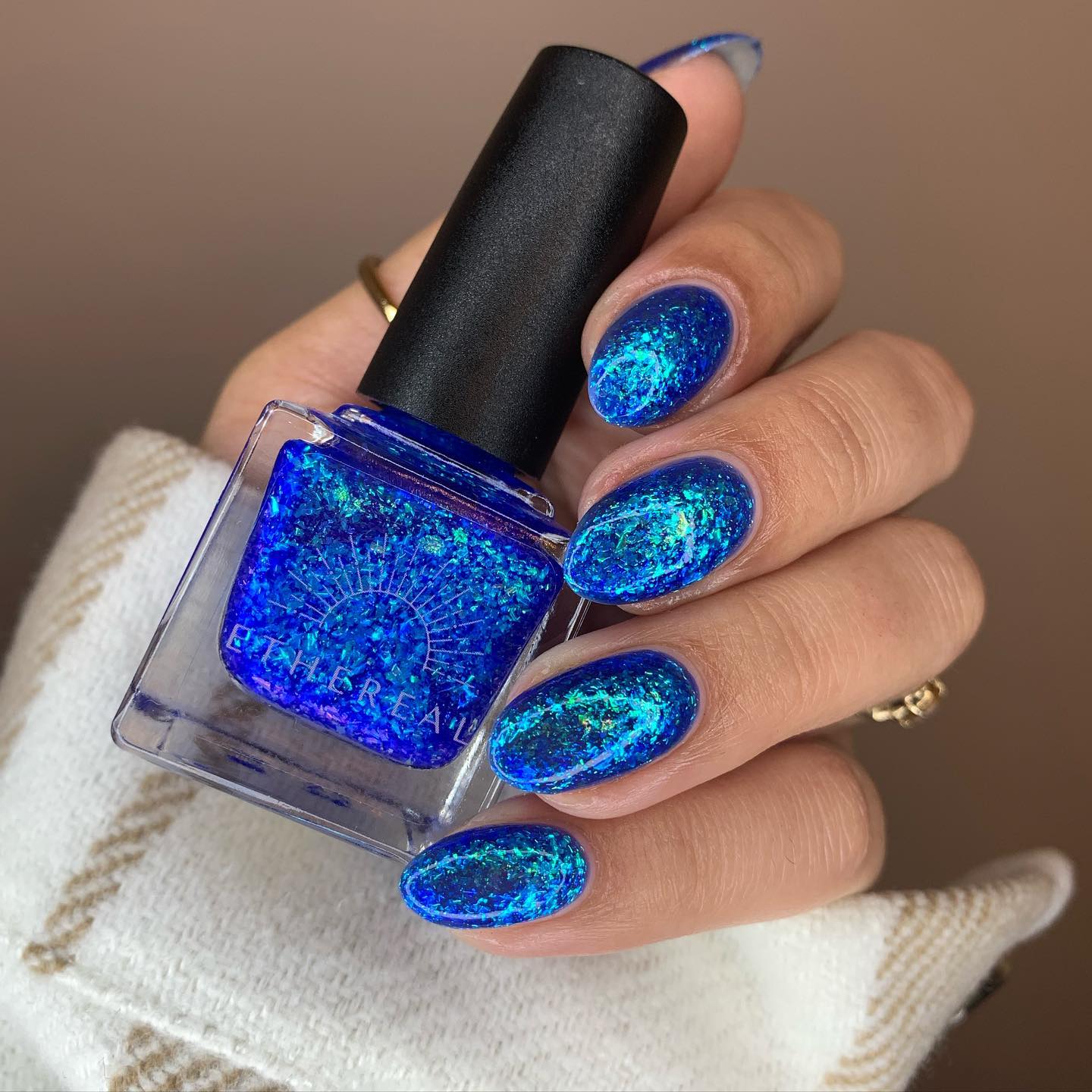 The best thing about blue glitter nails is that they can be worn with almost any outfit or makeup look. We recommend wearing them with solid colors like black or white so that they really pop!