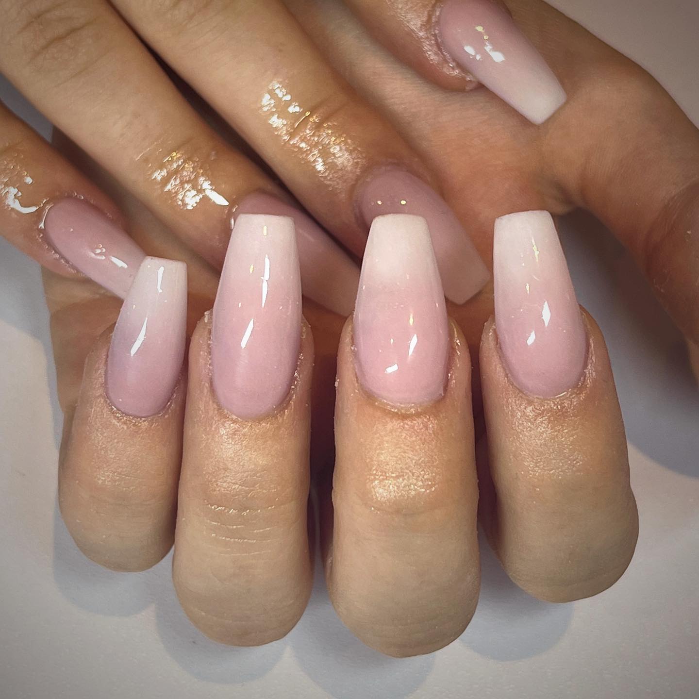 Sometimes all you need is simplicity. In this look, a sharp transition is not used between pink and white. Instead of that, a nude shade is combined with the soft pink nail polish.
