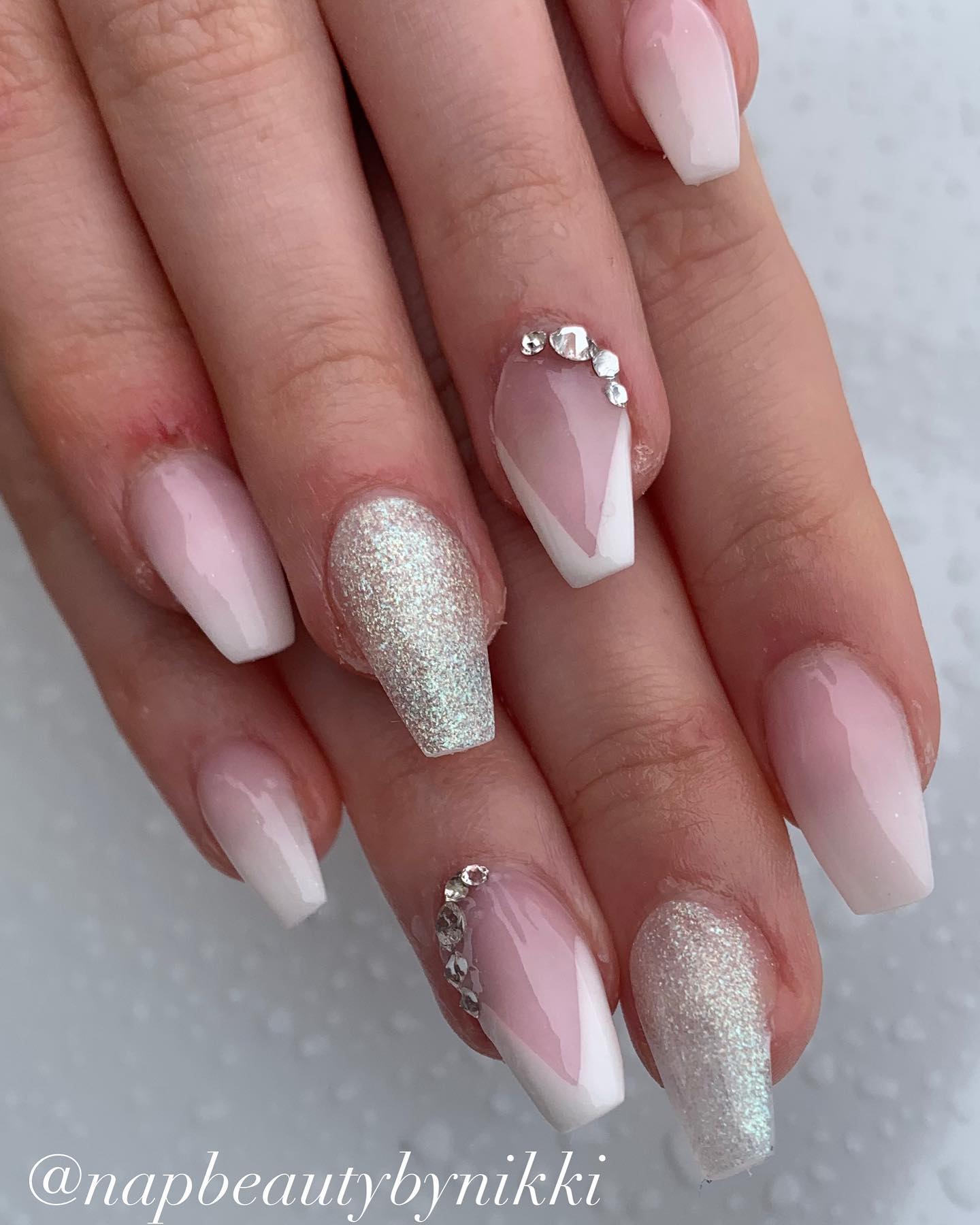  It is sometimes so hard to choose one design that looks good on you. To overcome this problem, why don't you apply more than one design to your nails? If you're up for this, use glitters, a French manicure and some stones for your ombre nails.