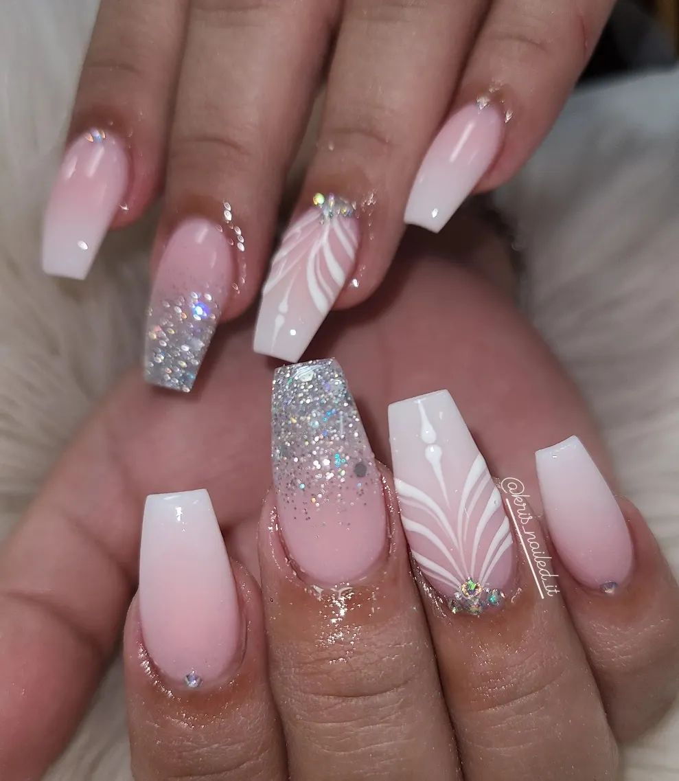 Simplicity may not be for you, so you can go for an artistic nail design like the one above. Go for a design in which white lines are used to create a nice pattern with a shiny stone. Also, you can have a glittered French mani to stand out.