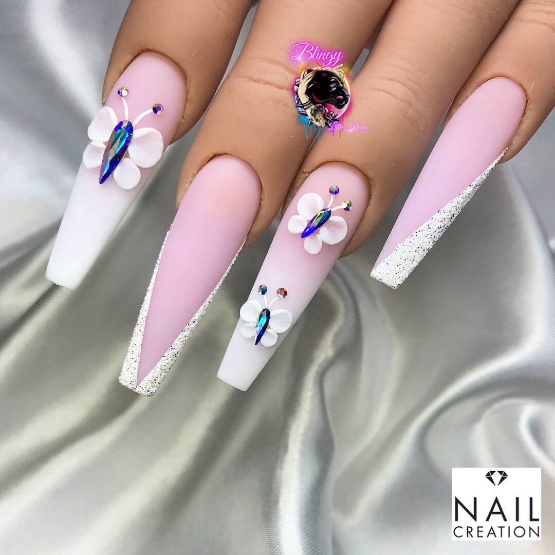 This pastel pink coloured acrylic powder is super stunning! Matte pink and white ombre accent nails add an extra beauty to this nail design and butterflies stand out more on them.