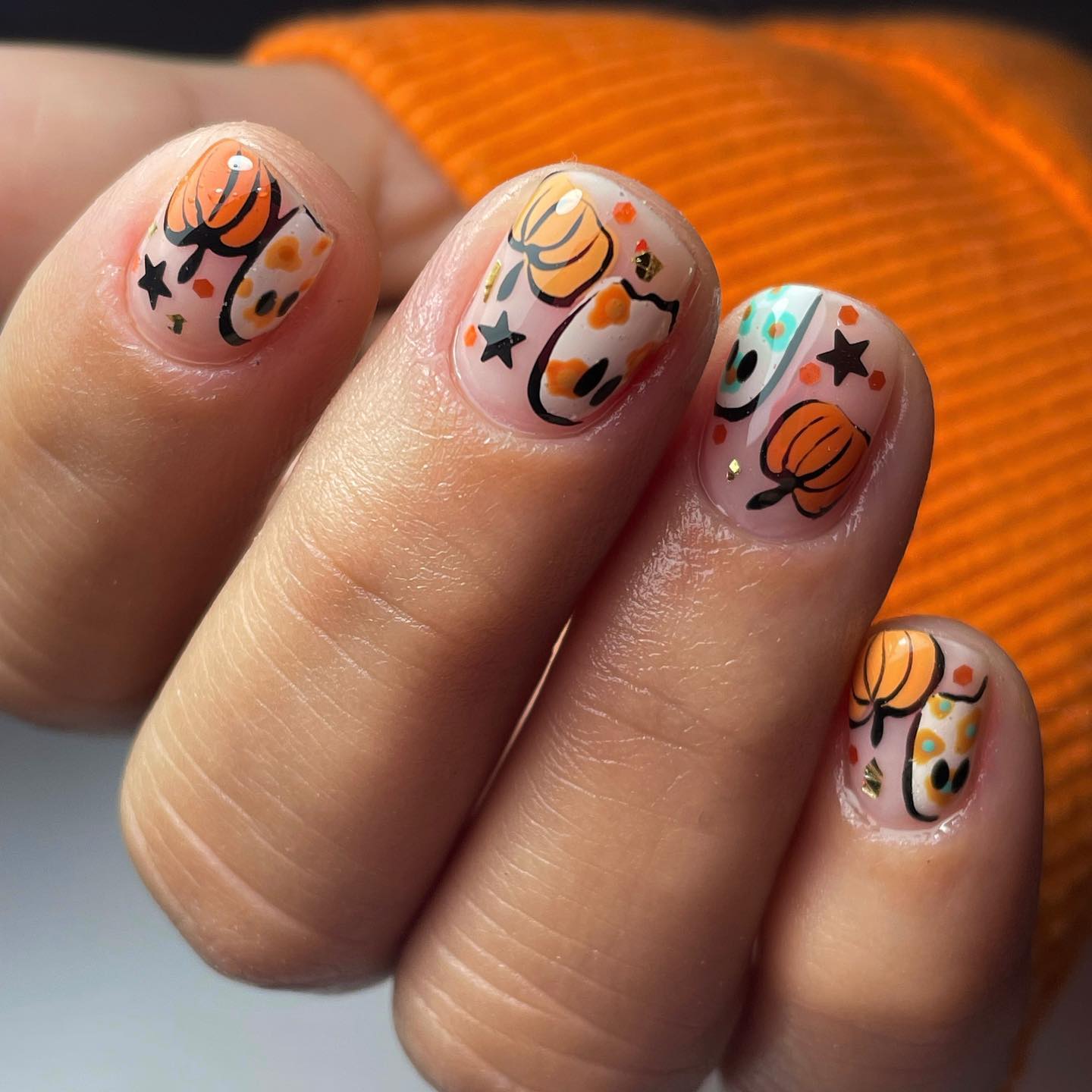 If you want to have fun with your nails, pumpkin nail art is amazing for you! Having pumpkin nails is an easy way to get into the Halloween spirit. To spice up your look, you should consider applying it.
